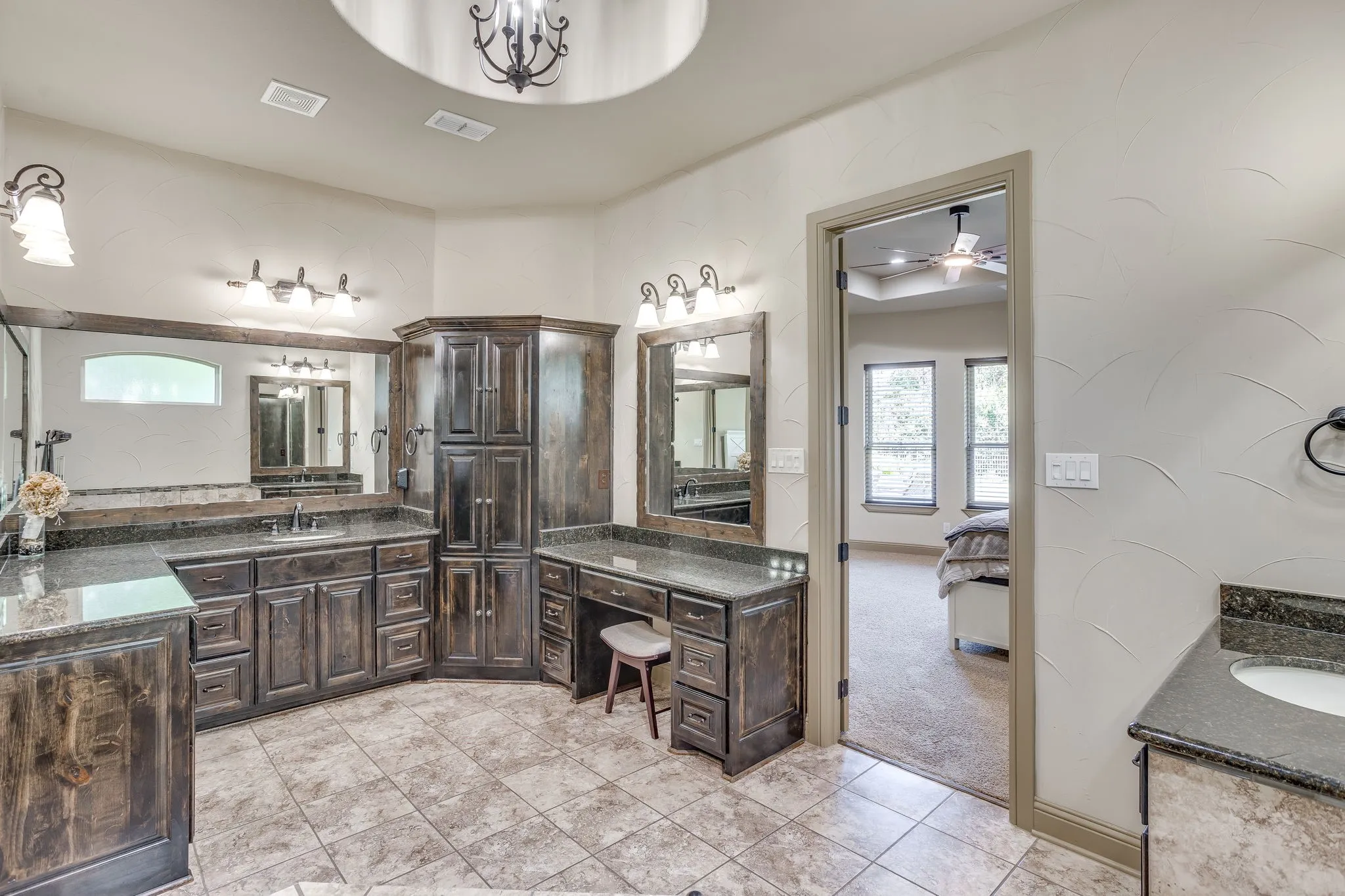 The primary bath features double vanities, a jetted tub, separate walk-in shower & large walk-in closet.