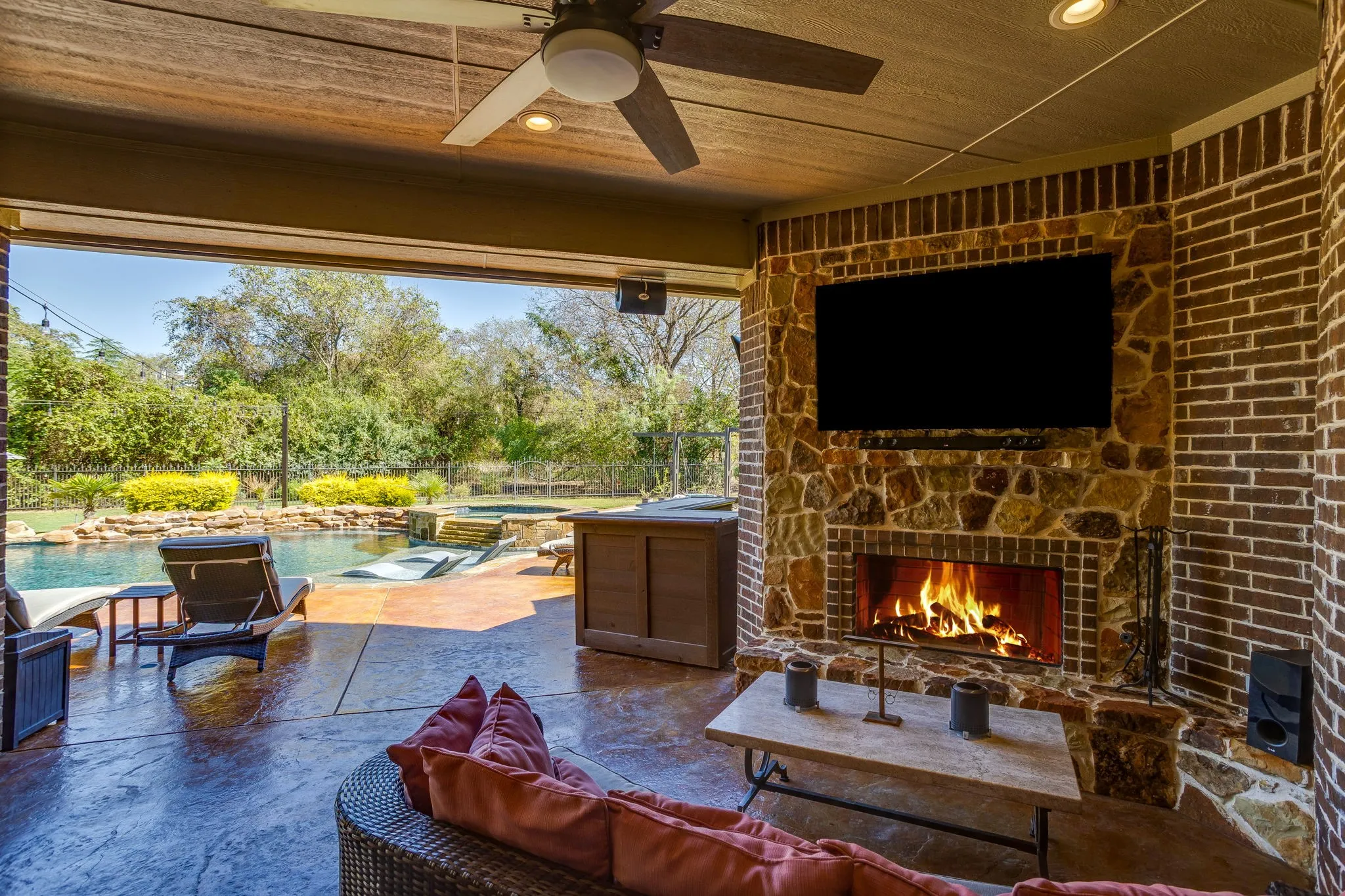 The oversized patio includes a woodburning fireplace, speakers and is the perfect place to relax.