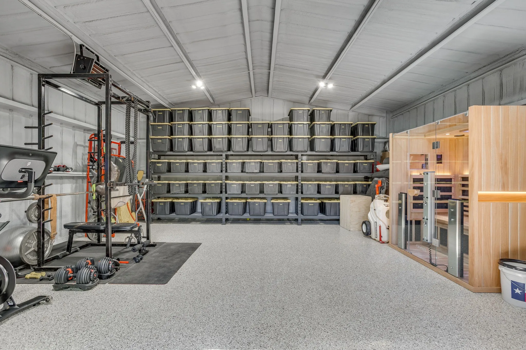 24x24 foam insulated shop with separate electric sub panel, heat and AC and epoxy flooring.