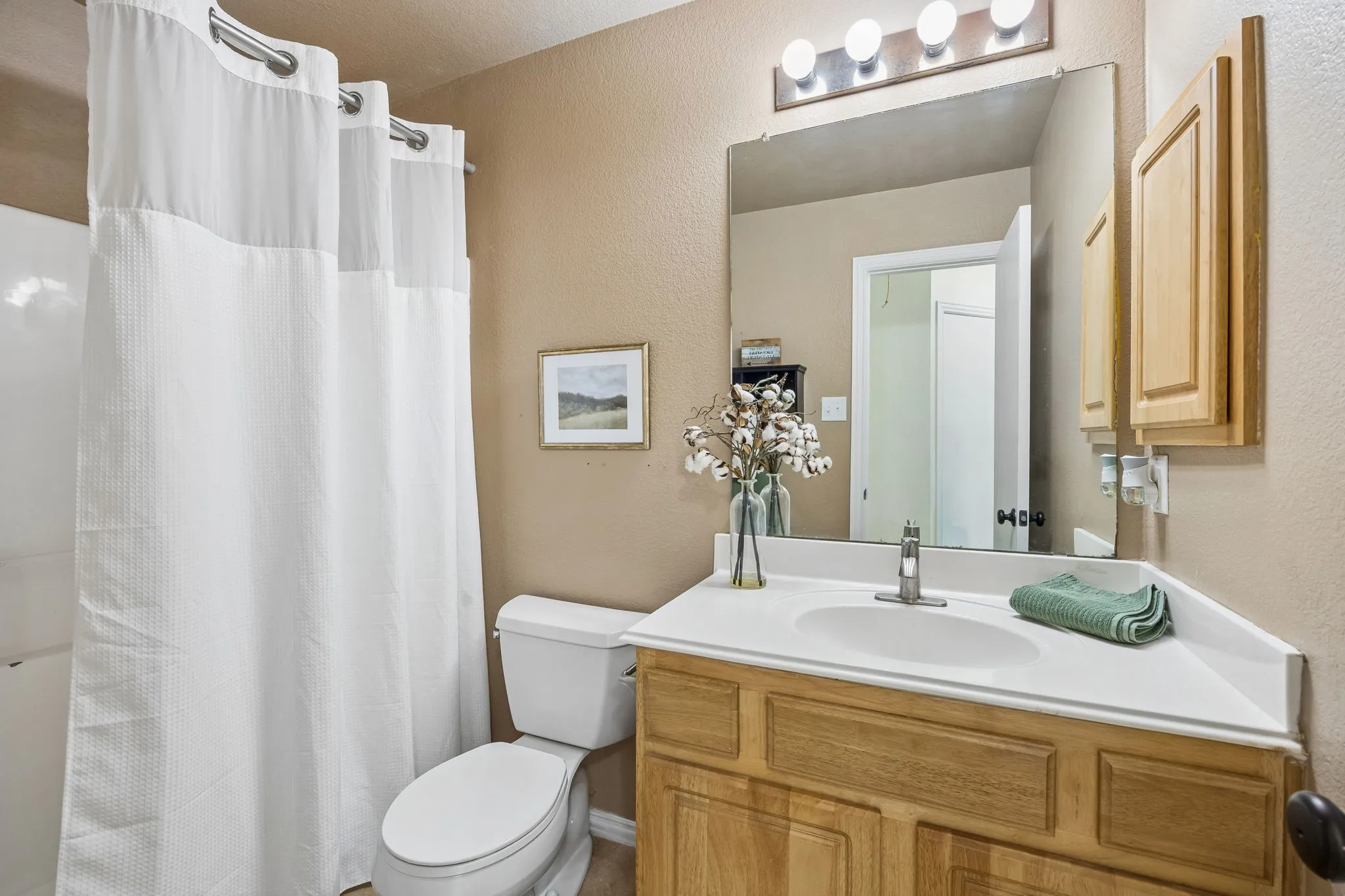 Secondary bathroom with convenient access for bedrooms and guests.