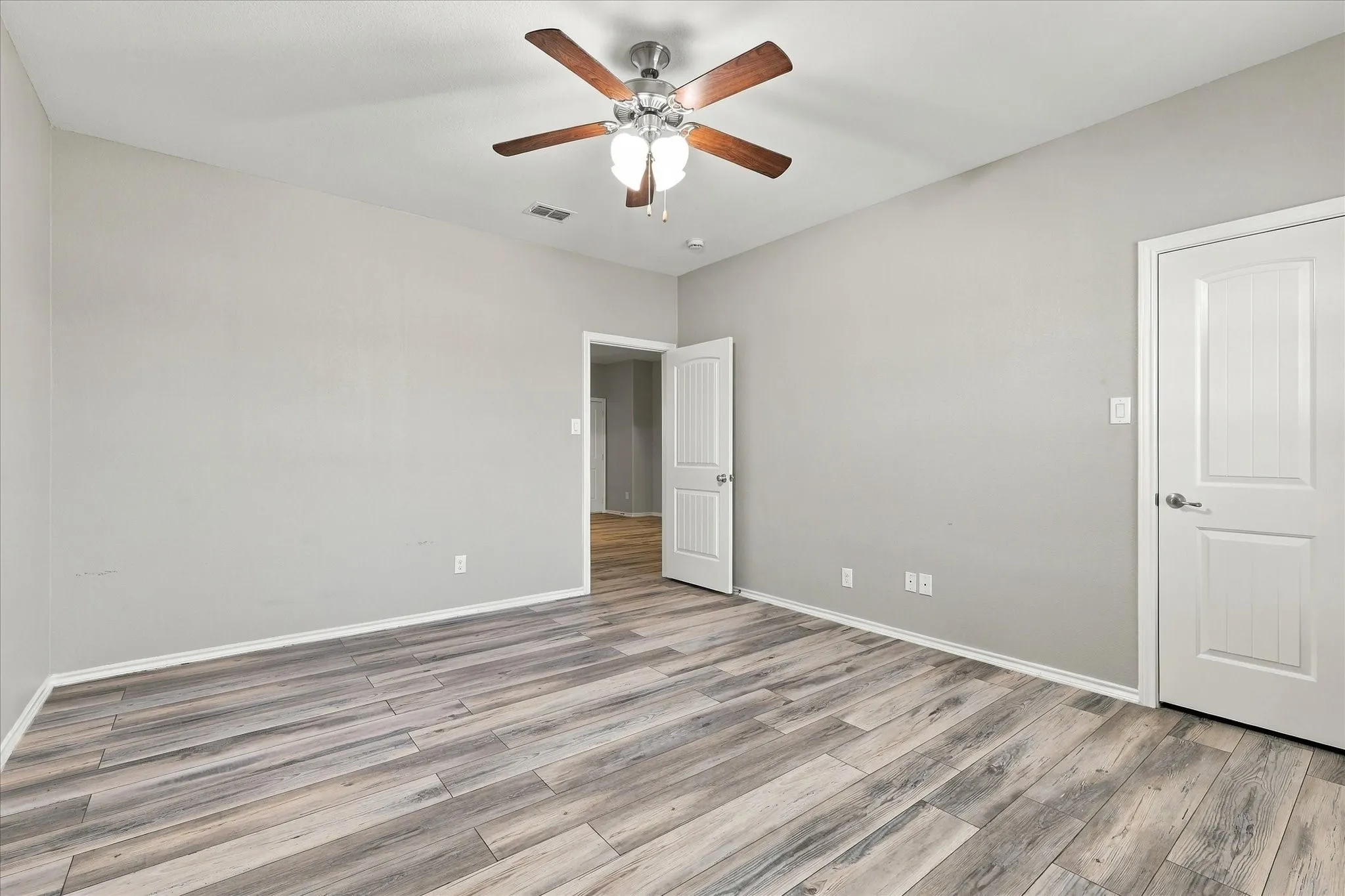 Wood-finish flooring with a neutral paint palette and white trim