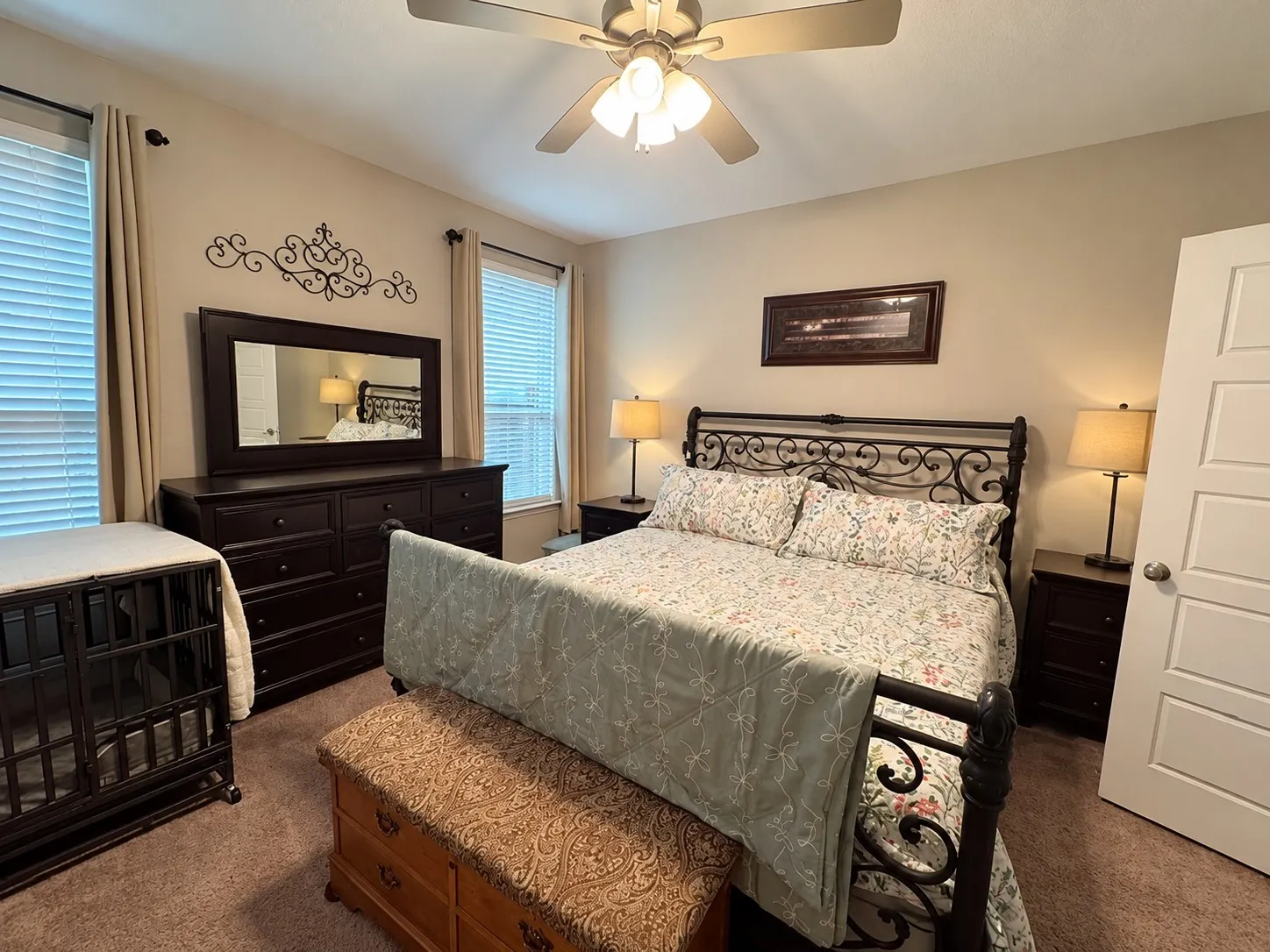 Recessed lighting, ceiling fan fixture, neutral wall paint, white paneled door, and carpeted flooring