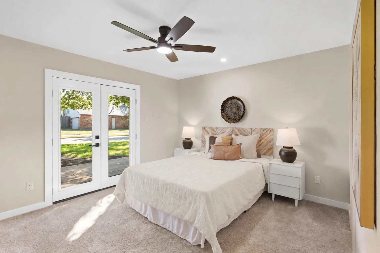 Neutral-toned walls complement plush carpeting