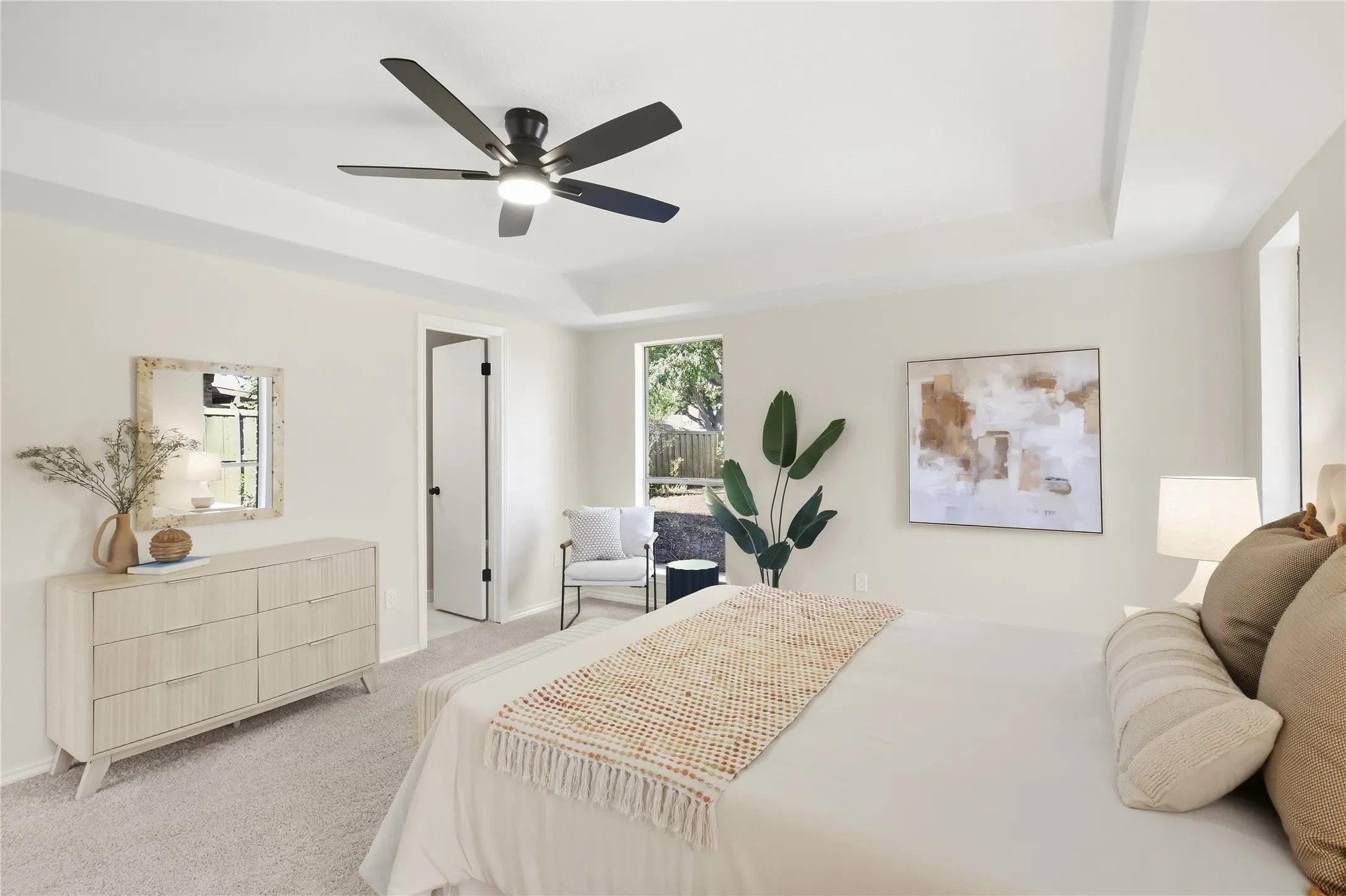 Tray ceiling with recessed lighting and a ceiling fan