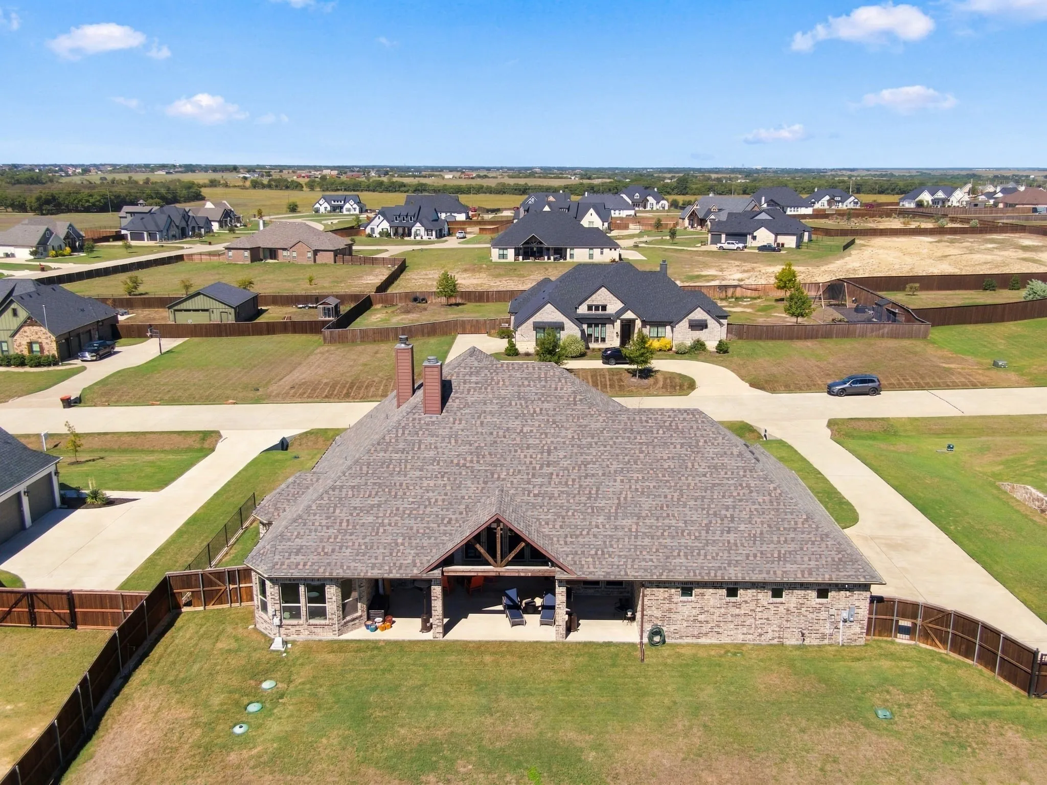 Another view of the back of the home. Has a walk in gate as well.