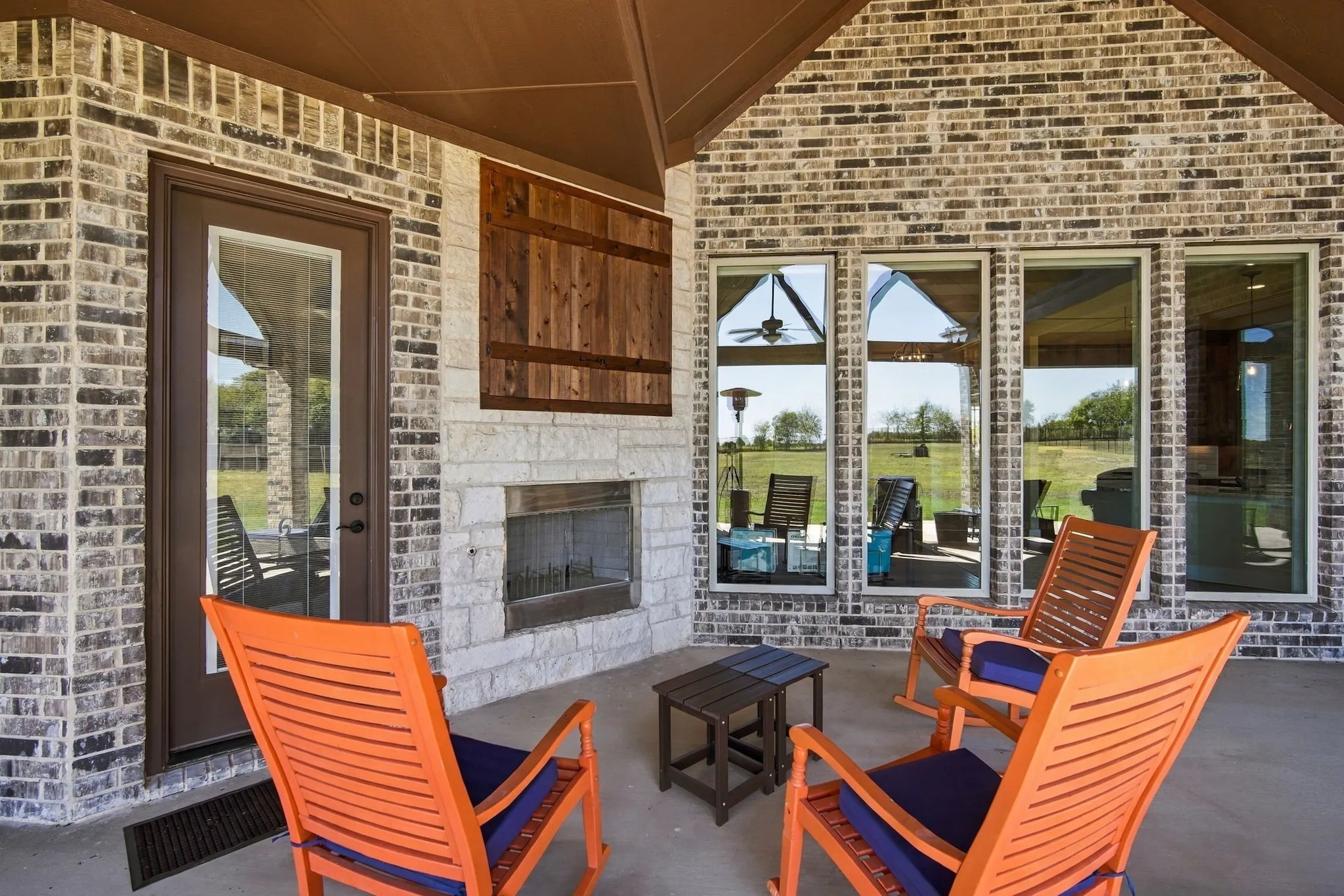 Two ways to get to the back patio, from the hall or kitchen. This is a great spot to relax in front of the fireplace.