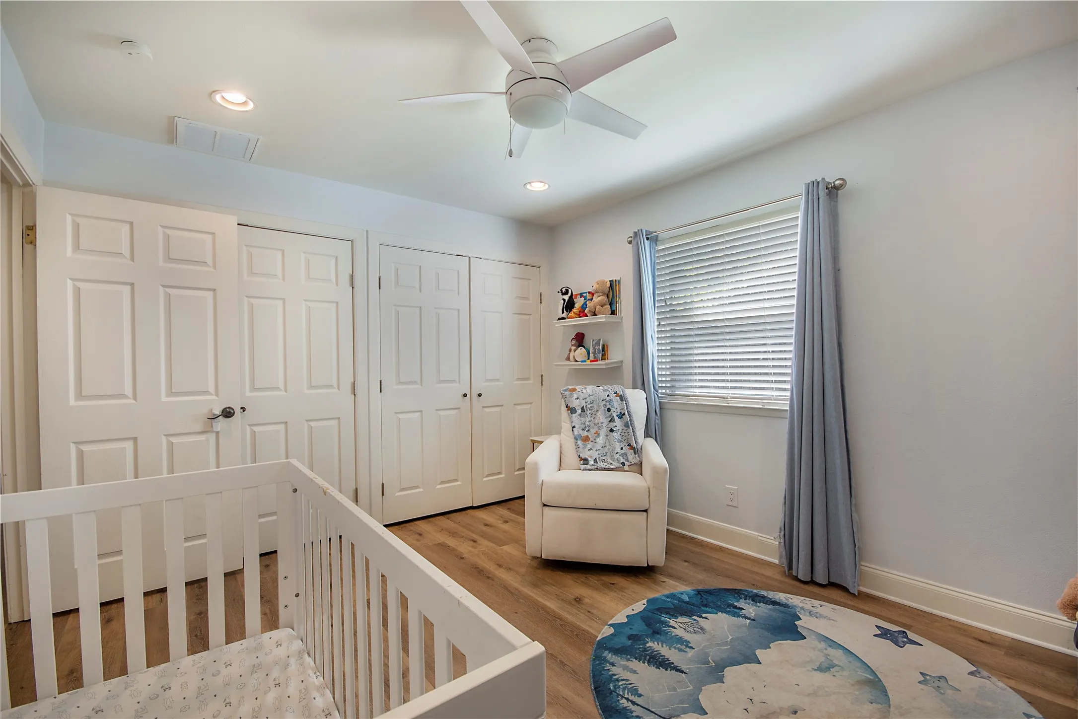 Wood-finish flooring, recessed lighting, and a ceiling fan