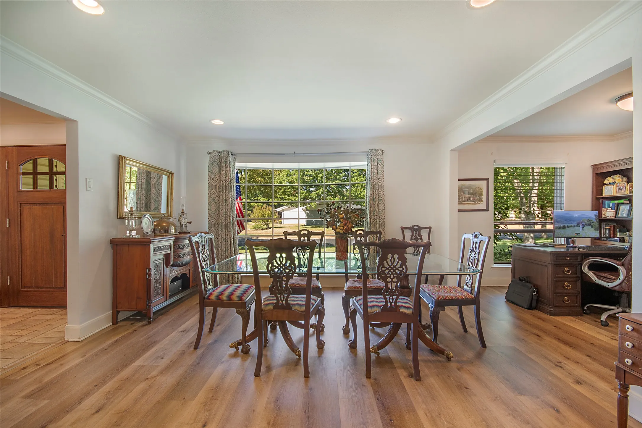 Recessed lighting, wood-finish flooring, and crown molding