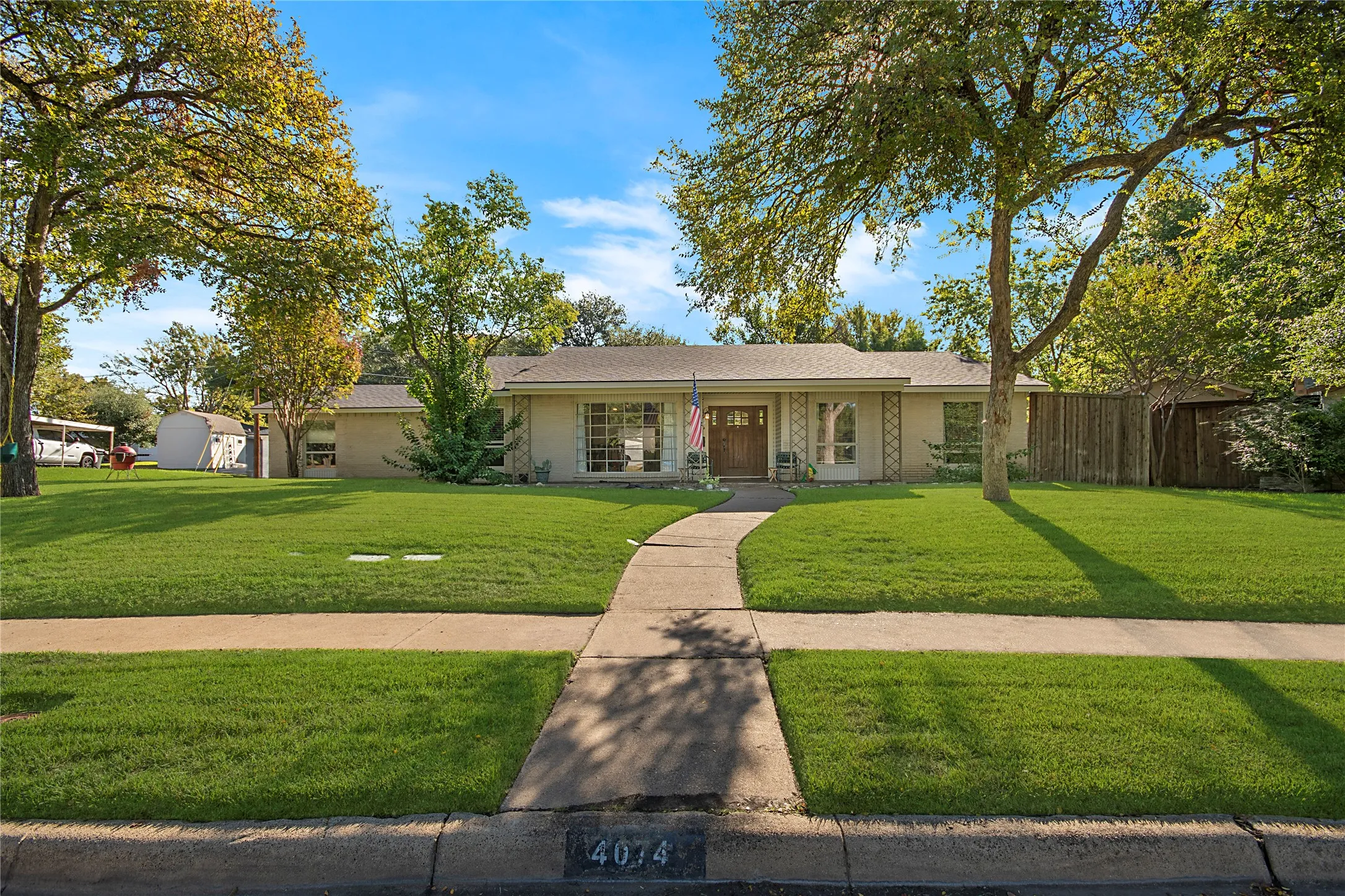 Single-story residence with a light-colored exterior and a gabled roof