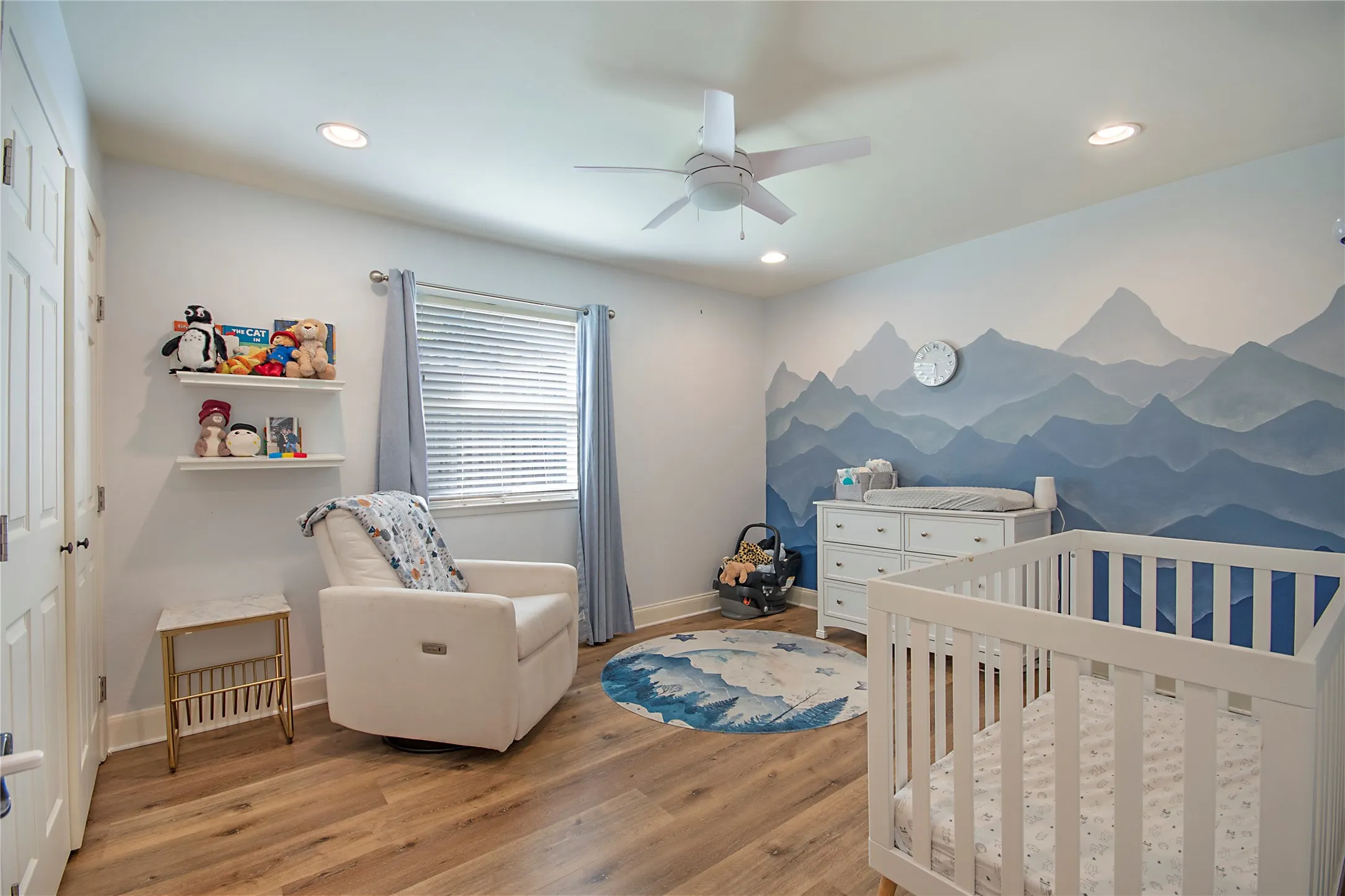 Wood-finish flooring, recessed lighting, and a ceiling fan