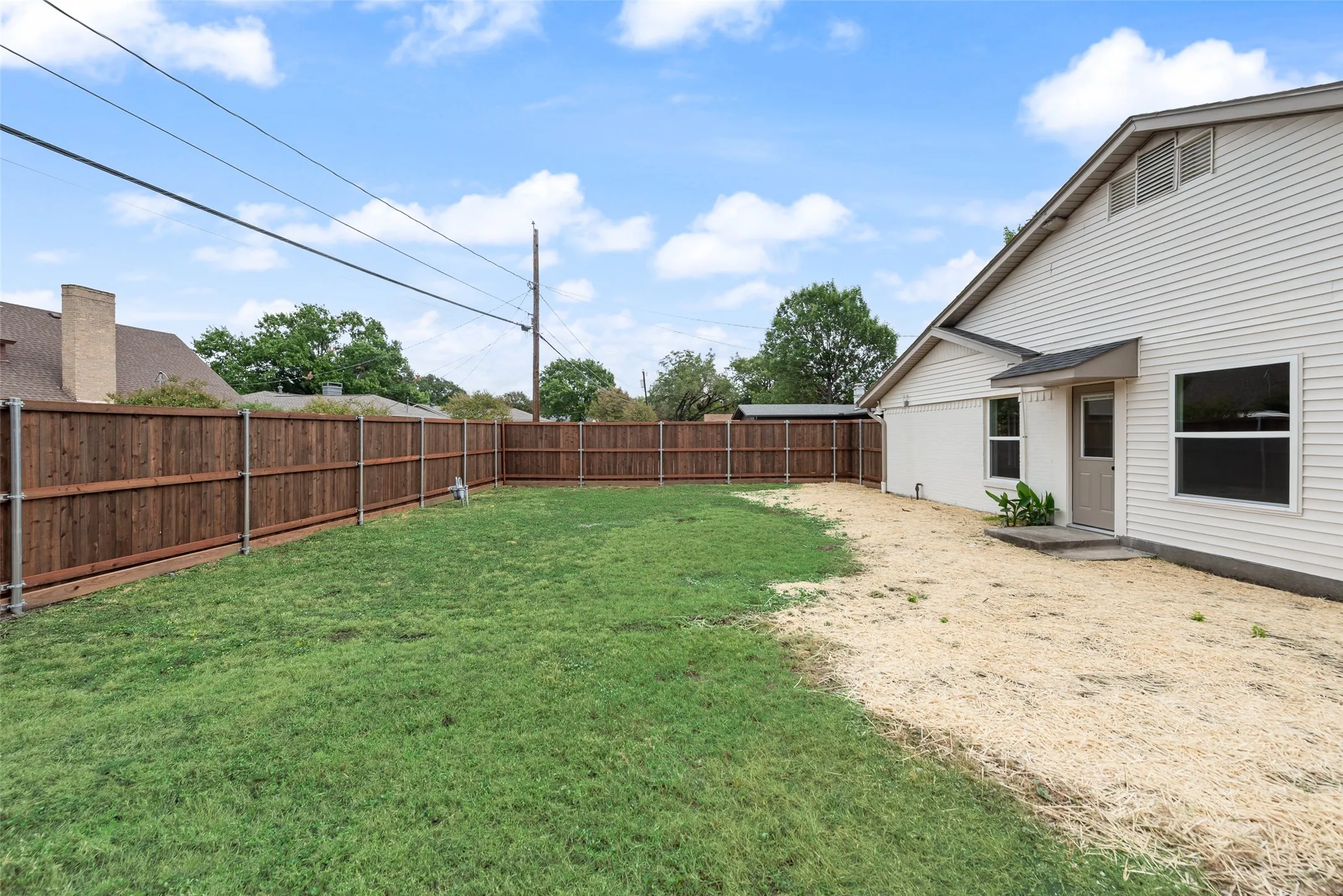 Second backyard view highlights the generous outdoor space.