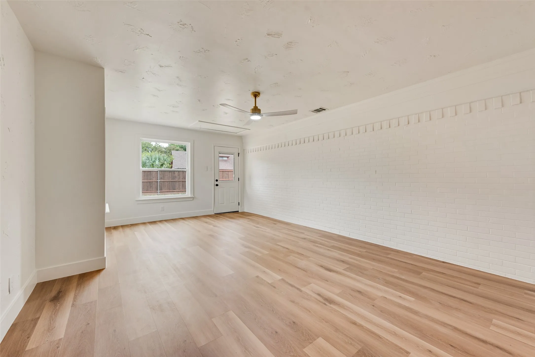 Spacious family room with plenty of room to relax or entertain.