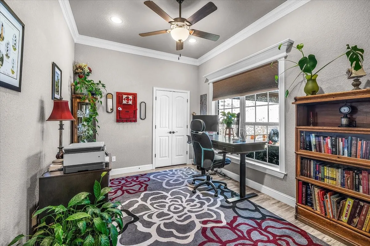 Office / Optional 5th Bedroom: Versatile room features a closet, ceiling fan, neutral finishes, and natural light, offering flexibility for use as a home office or potential fifth bedroom.