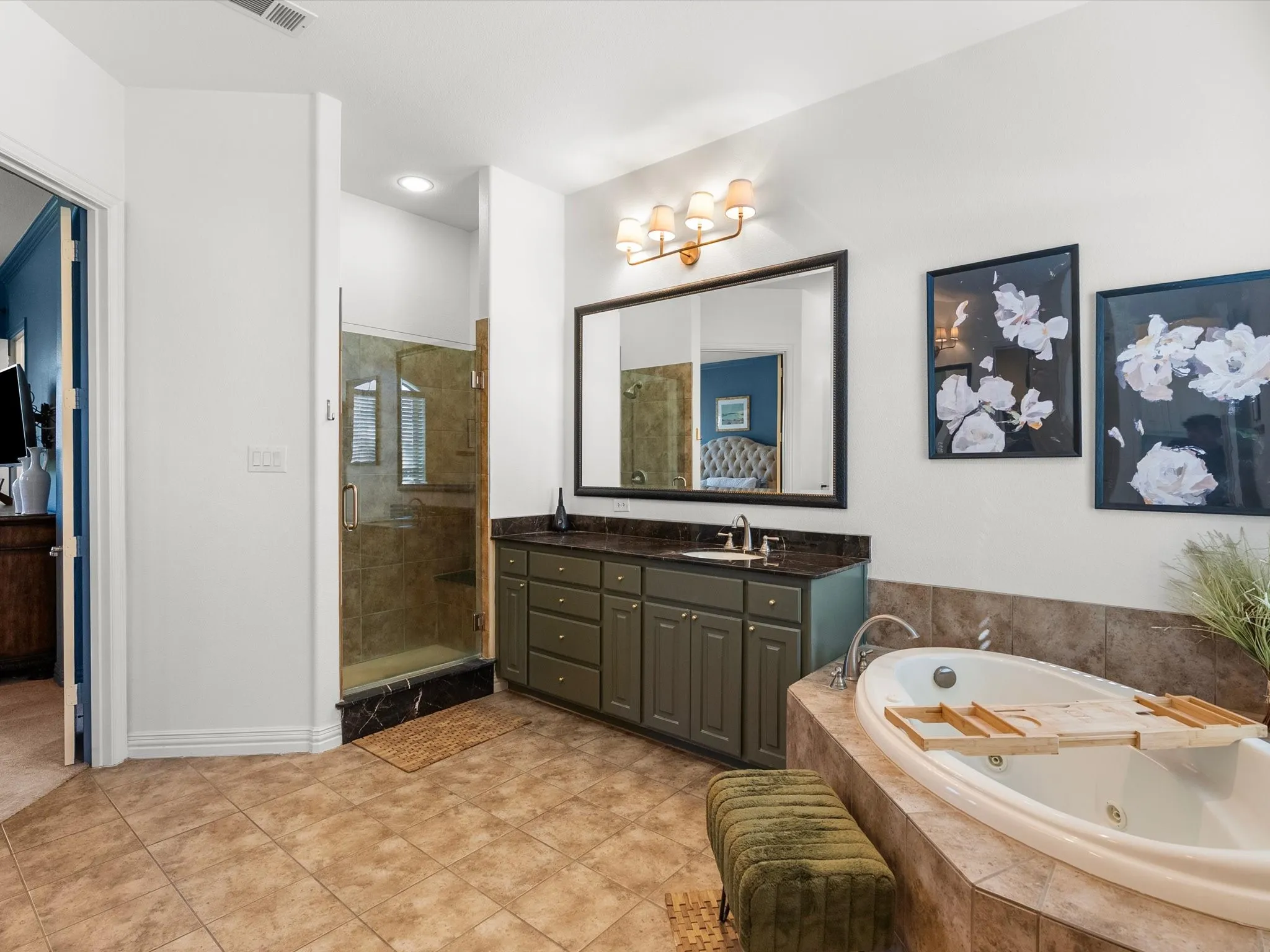 Large, jetted soaking tub and walk-in shower