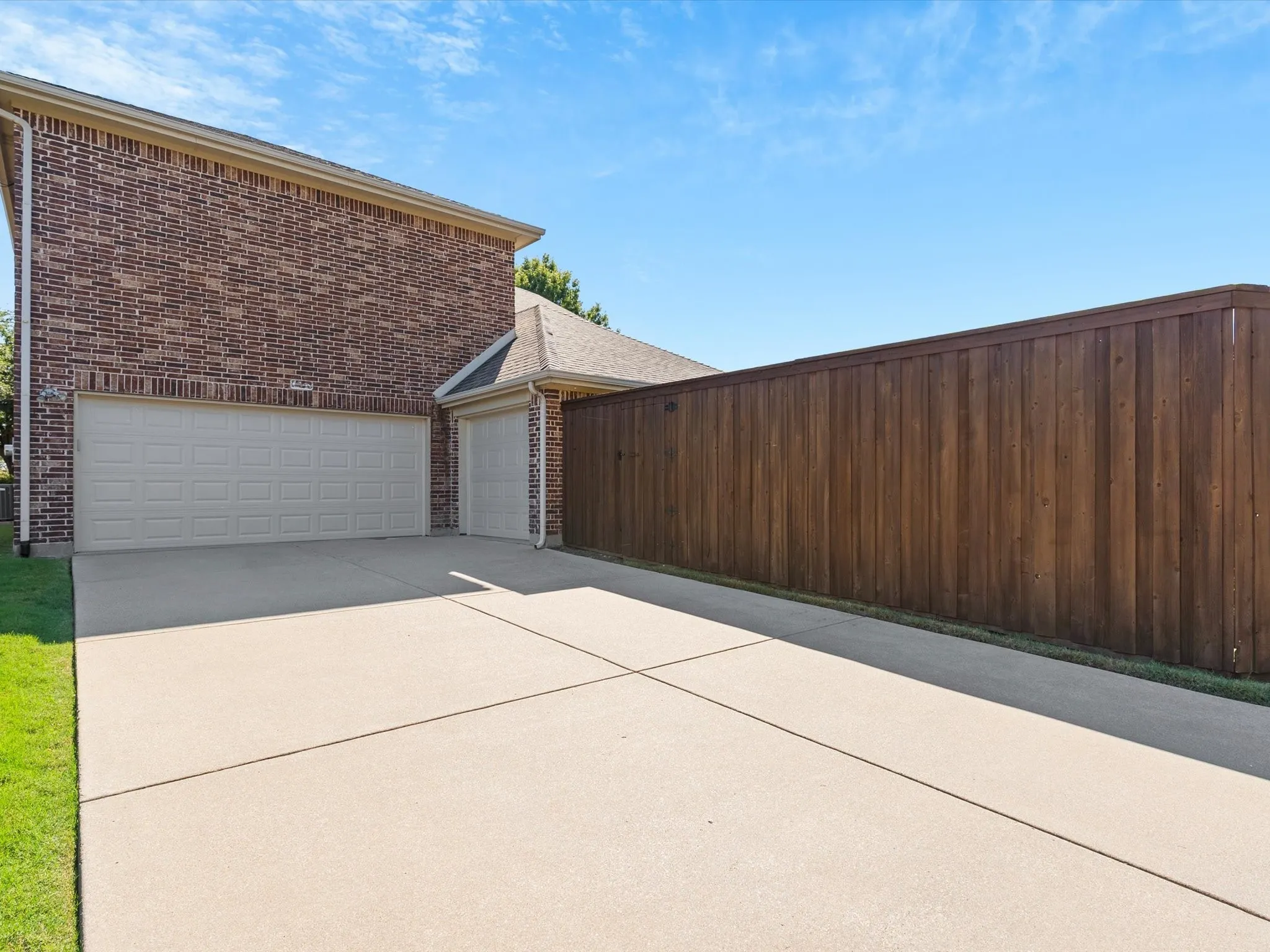Three car garage complete with storage closet