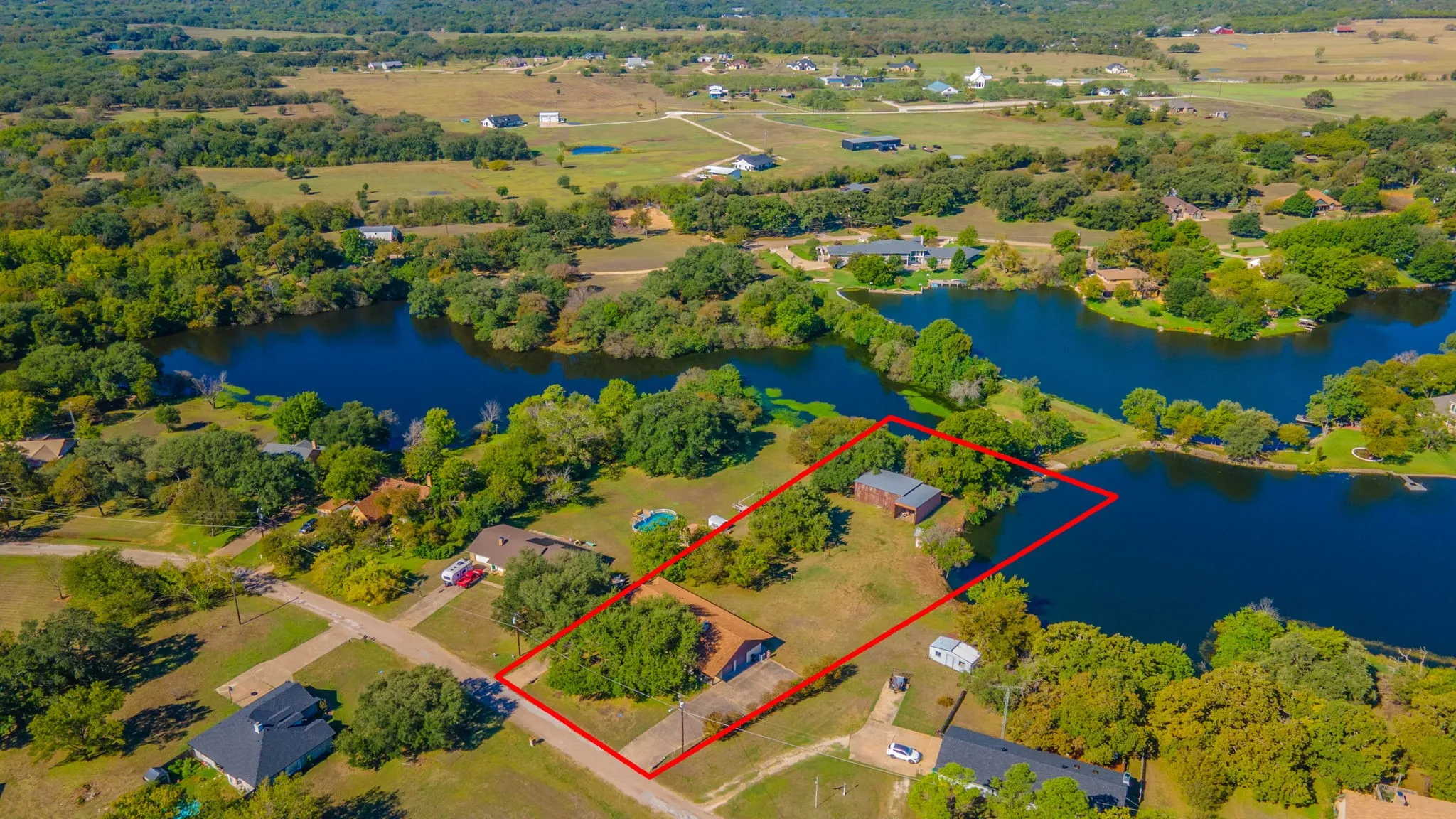 Estimated property lines. Buyers should confirm with a survey. Property line goes into the water on both sides of the shop.
