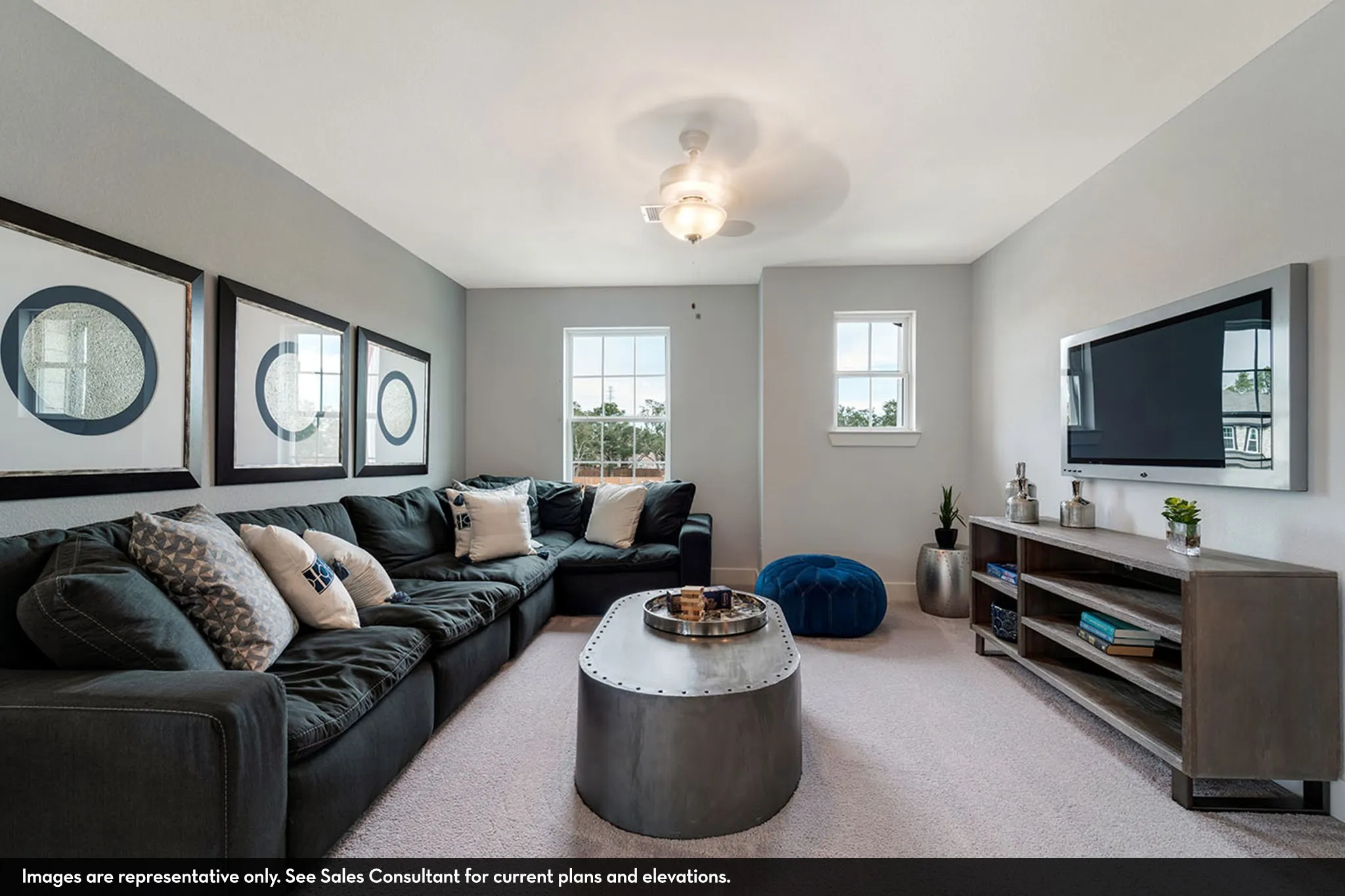 Recessed lighting, ceiling fan with integrated light, multiple windows, light-toned carpeting, and light gray wall paint