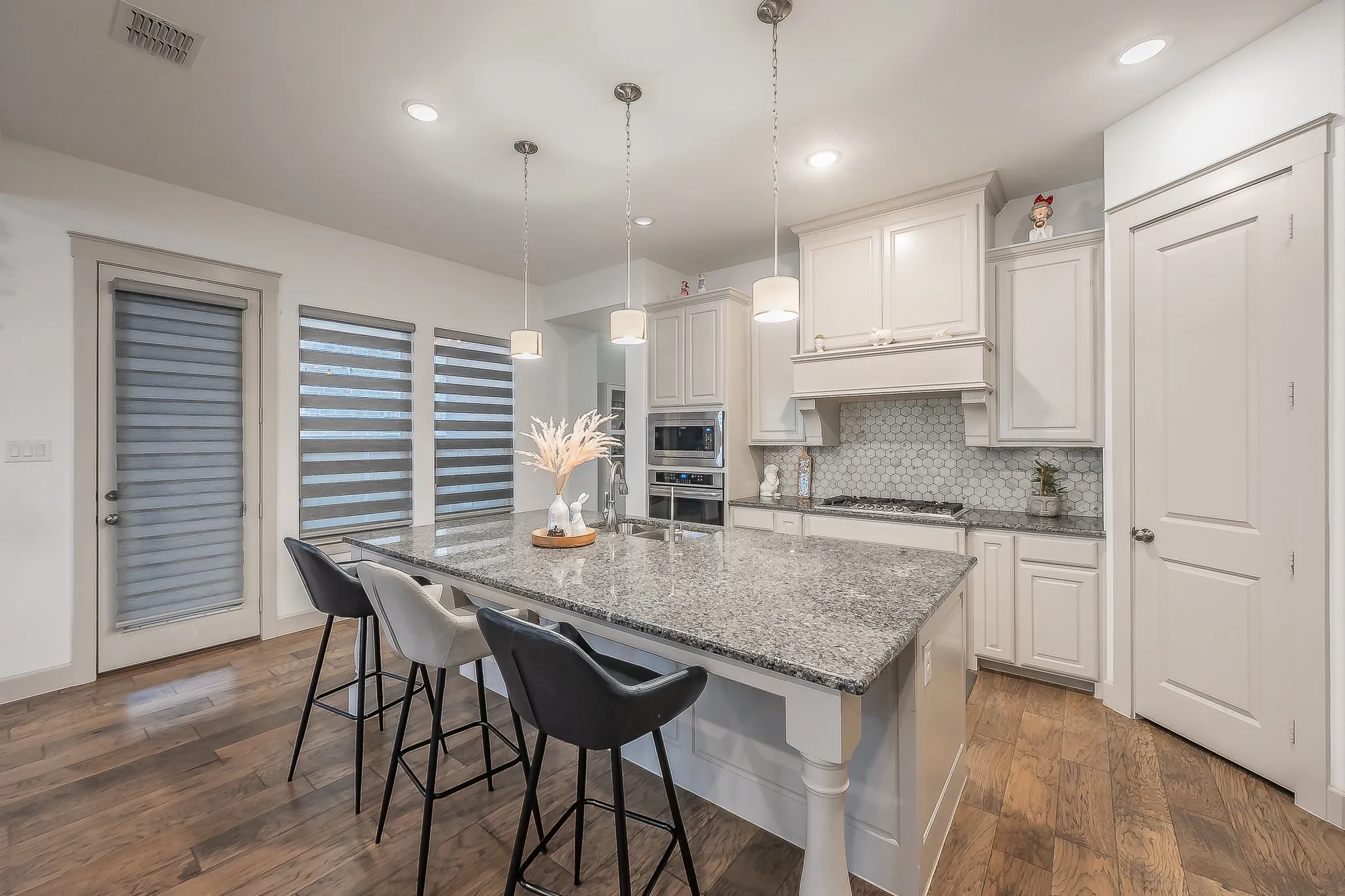 Kitchen featuring beautiful tile backsplash, large pots and pans drawers, and a walk-in pantry
