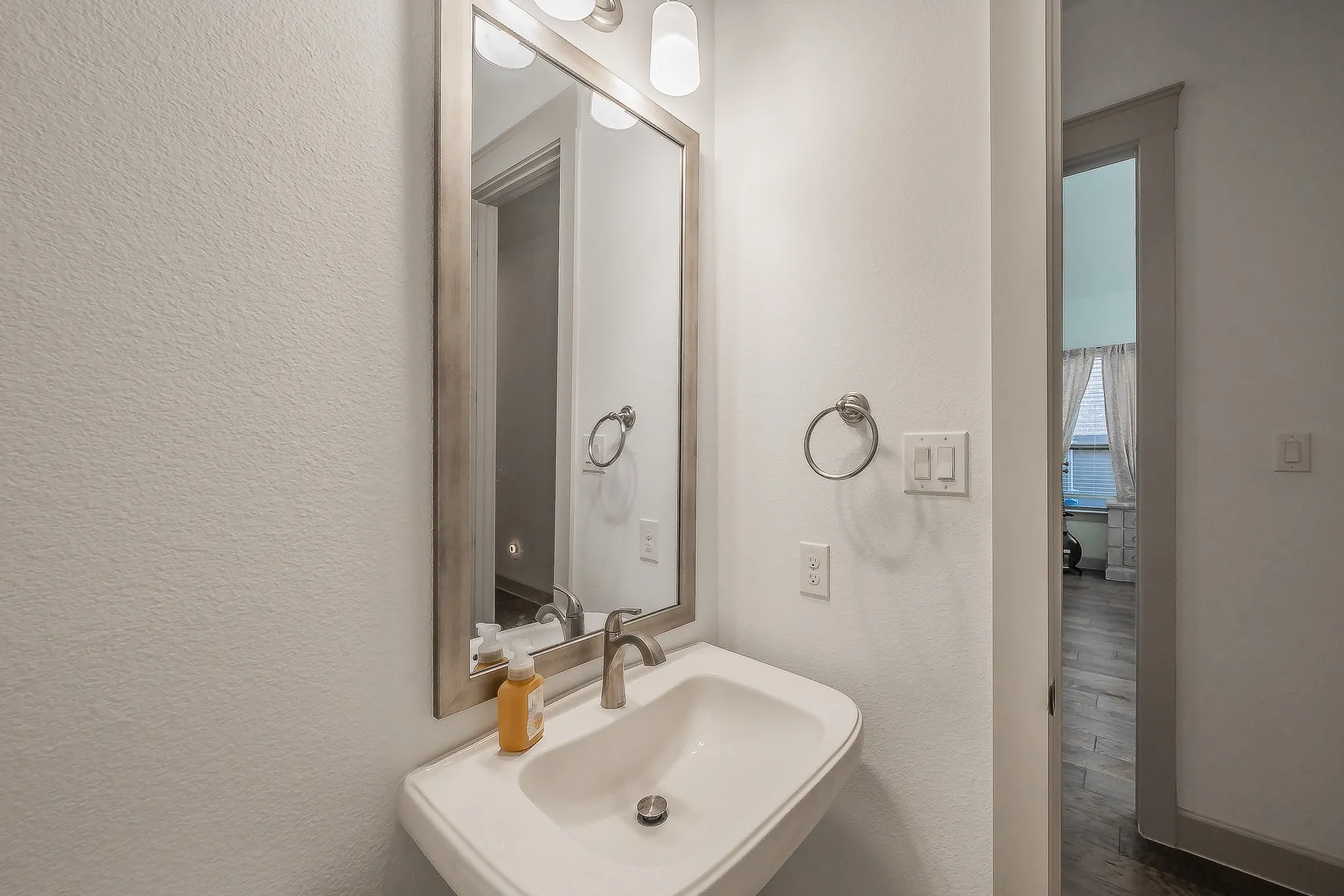 Pedestal sink in the first floor powder room