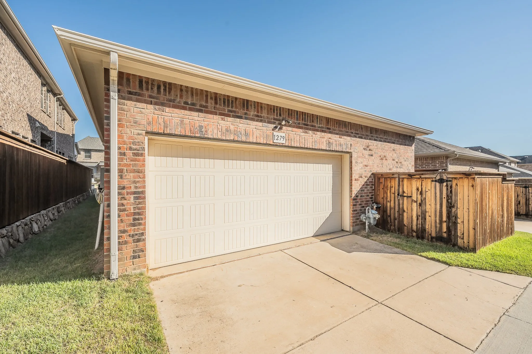 Ally entry 2 car garage with extended private back yard access