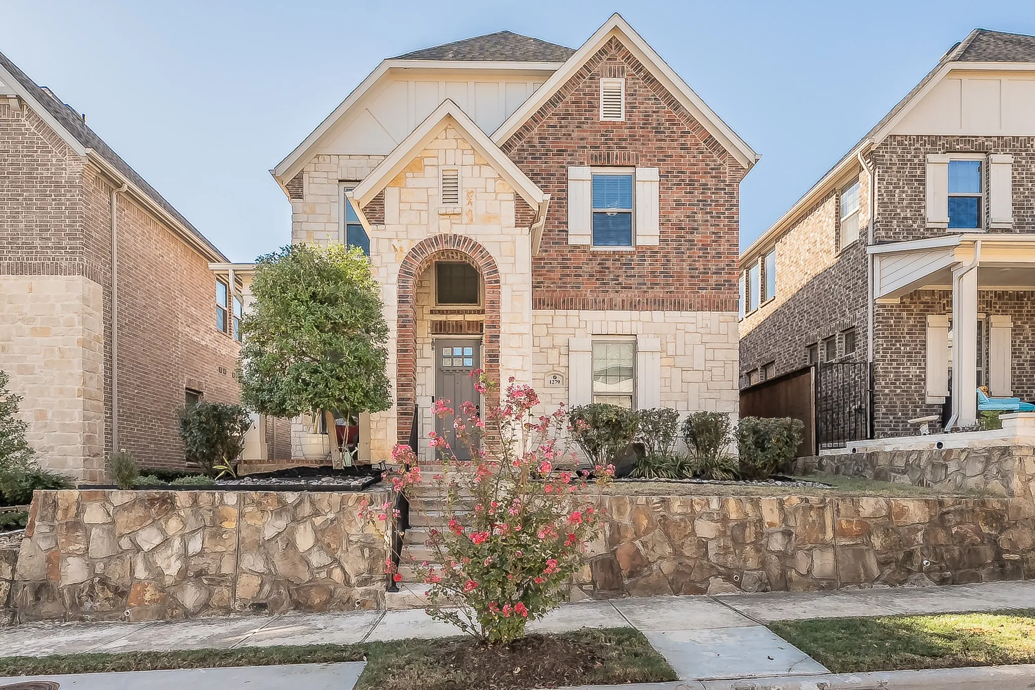 Tudor style elevated front view with stunning curb appeal