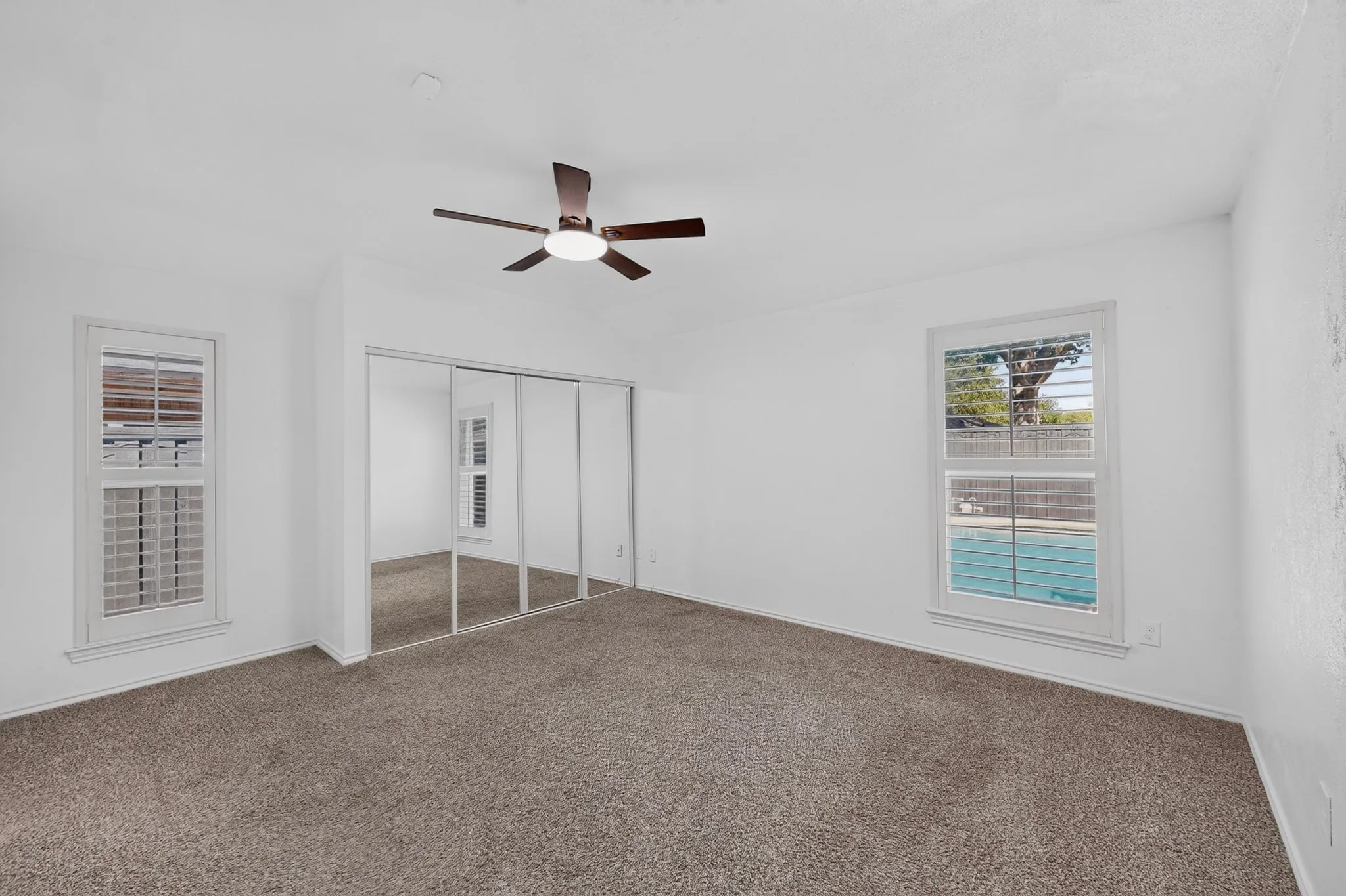 Primary overlooking the backyard