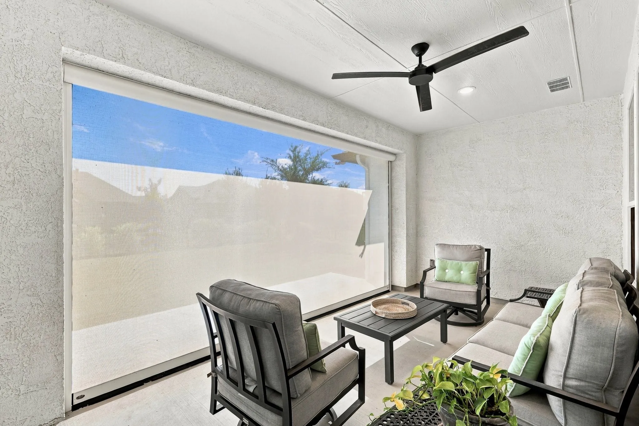 The extended covered patio features a remote-controlled retractable screen, creating a comfortable, versatile space for outdoor relaxation and​​‌​​​​‌​​‌‌​‌‌​​​‌‌​‌​‌​‌​​​‌​​ entertaining.