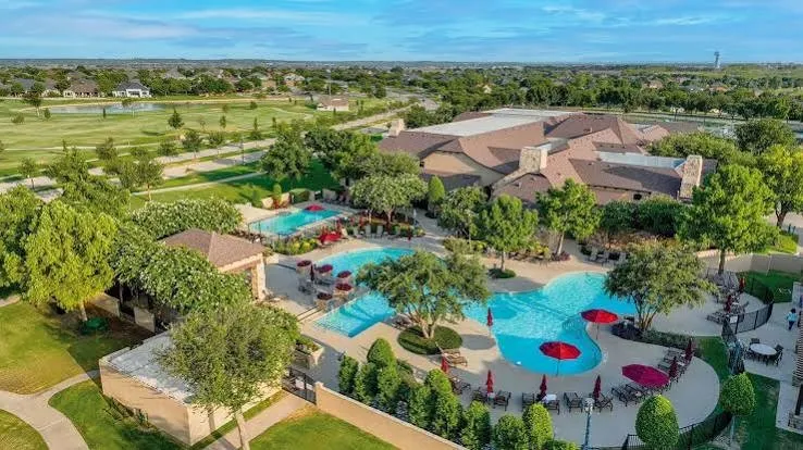 Relax and unwind at Robson Ranch’s resort-style outdoor pool, perfect for soaking up the Texas sunshine and enjoying the active adult lifestyle.