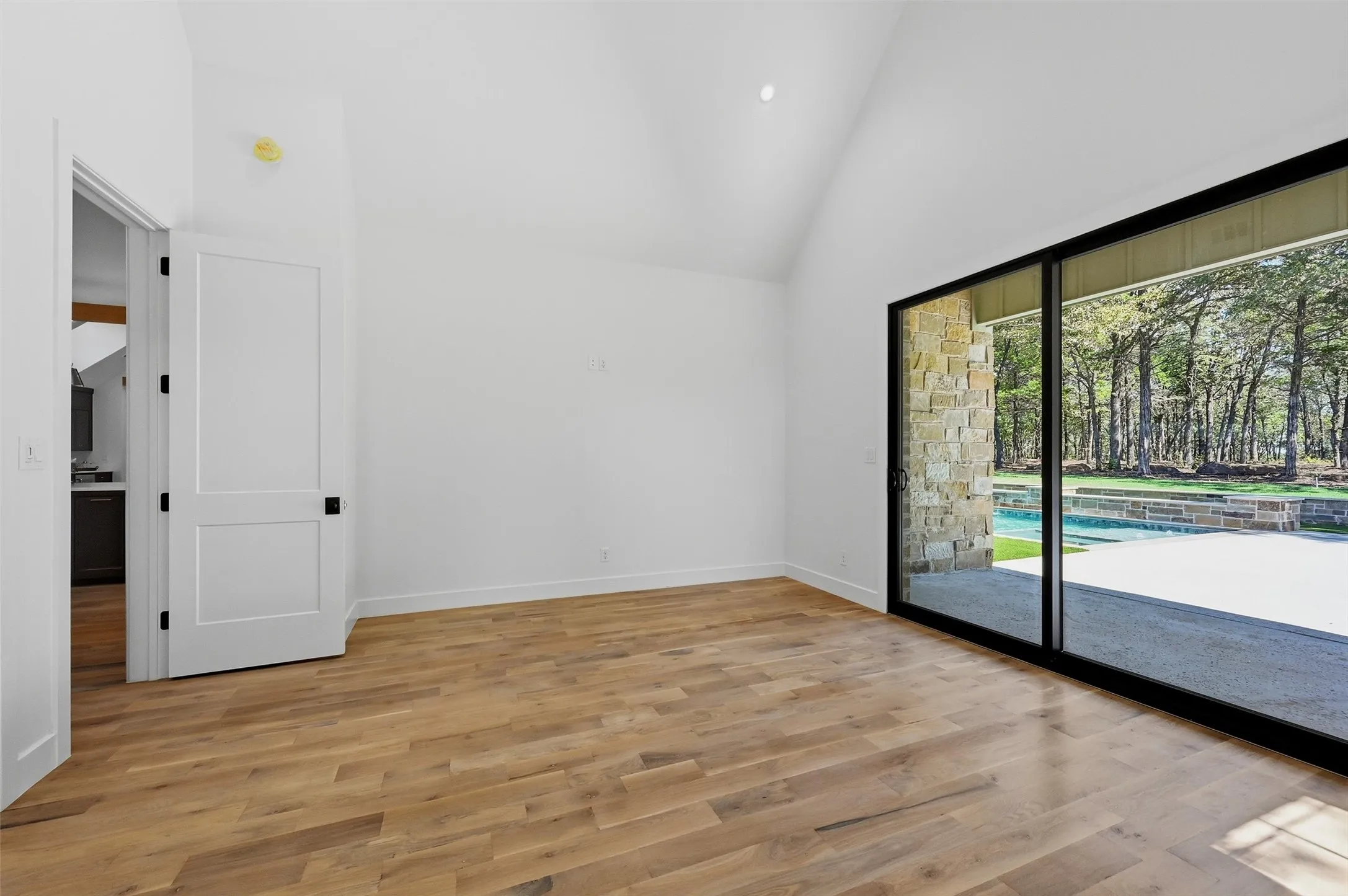 Vaulted ceiling with direct access to the pool and spa