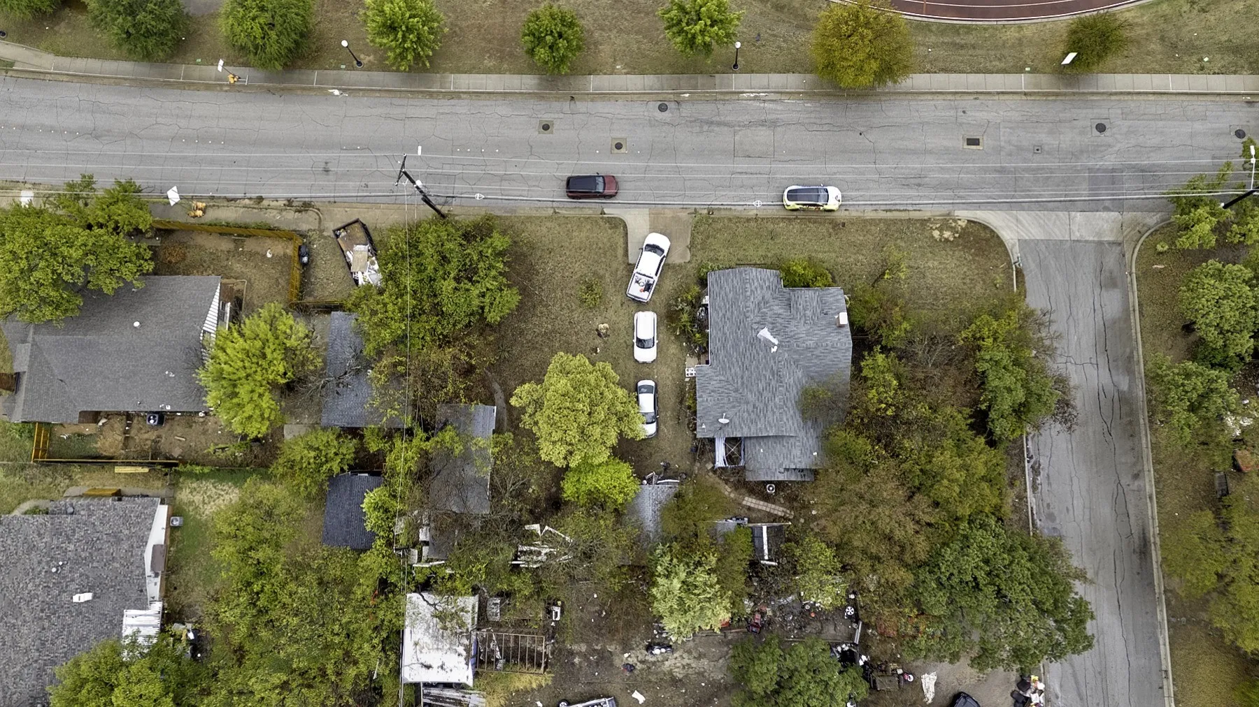 Overhead view of the 6455 Craig St corner lot in Fort Worth showing the home, driveway, mature trees and both streets