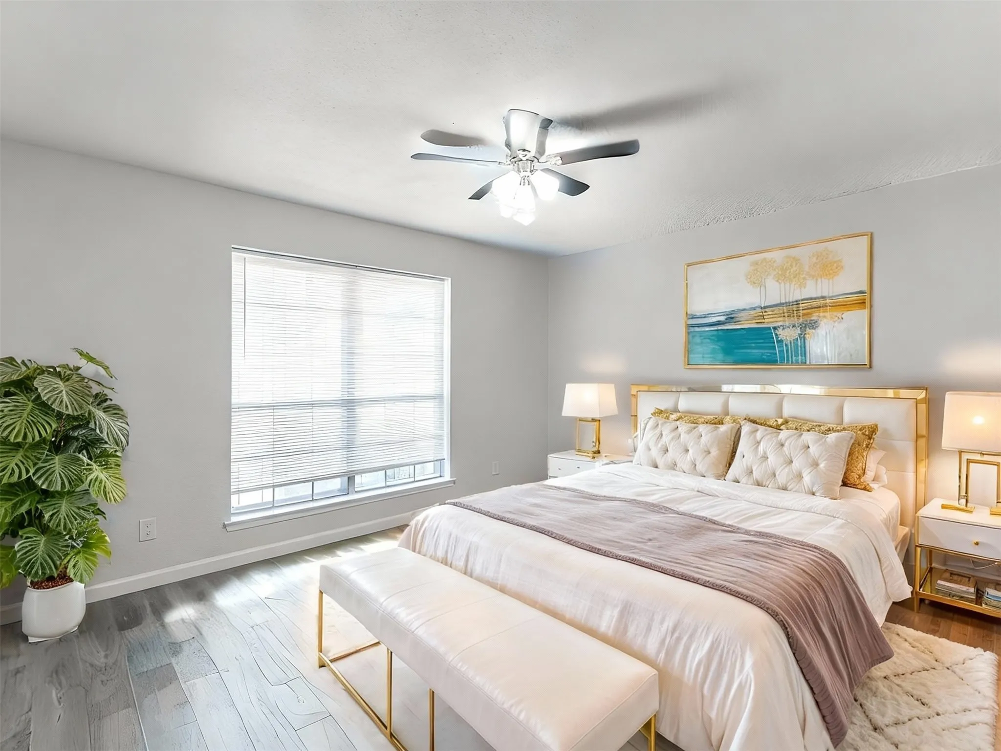 Bedroom 2 featuring wood finished floors and a ceiling fan