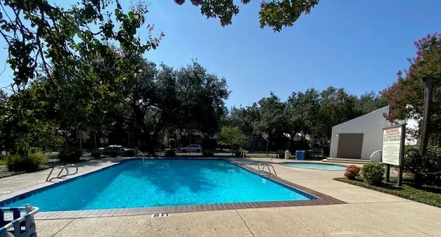 Community pool featuring a patio
