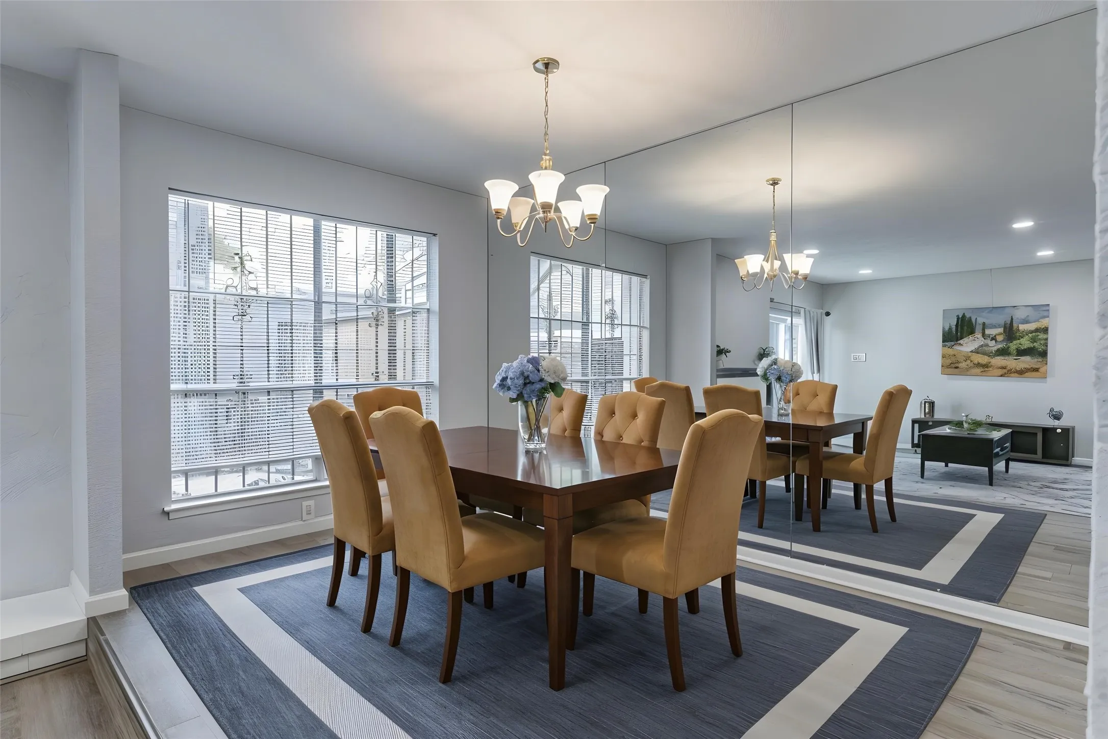 Dining room featuring wood finished floors, recessed lighting, and a chandelier