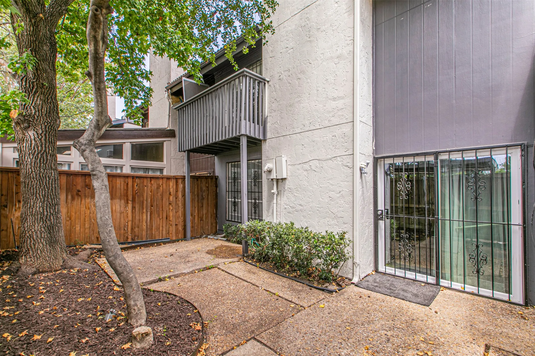 View of exterior entry featuring stucco siding