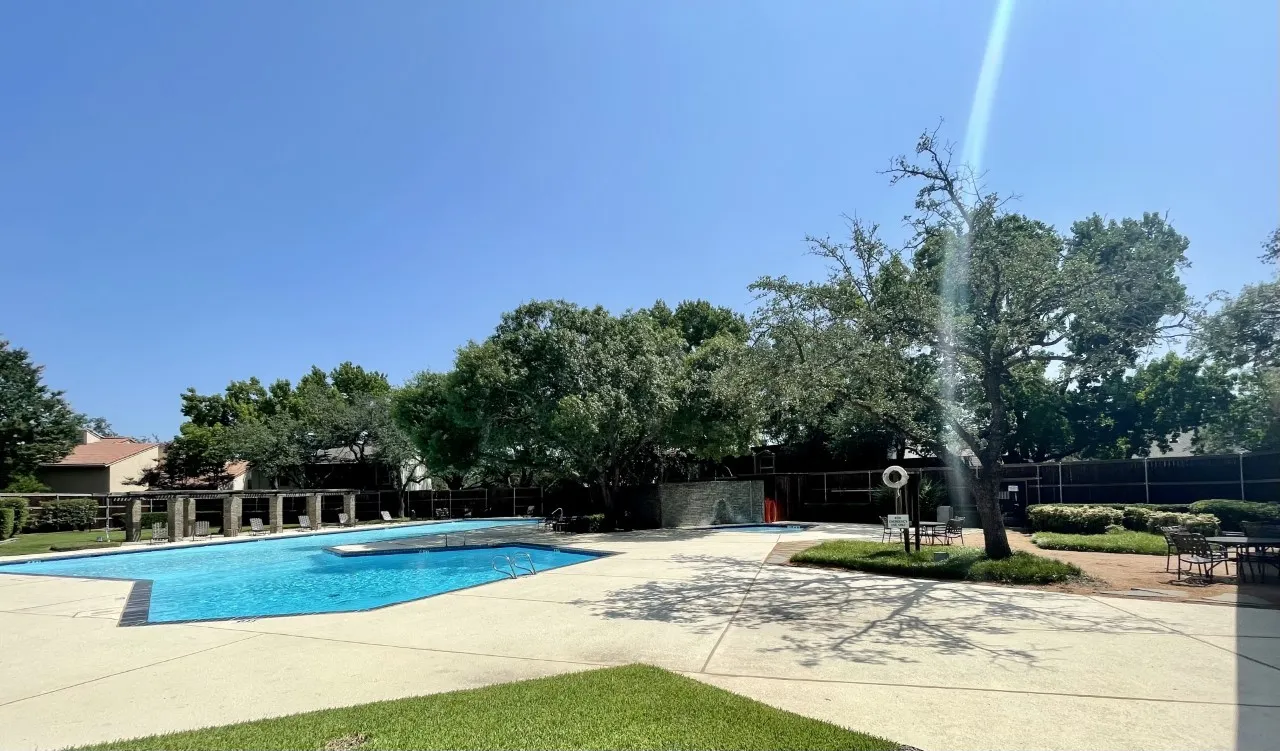 Community pool with a patio area