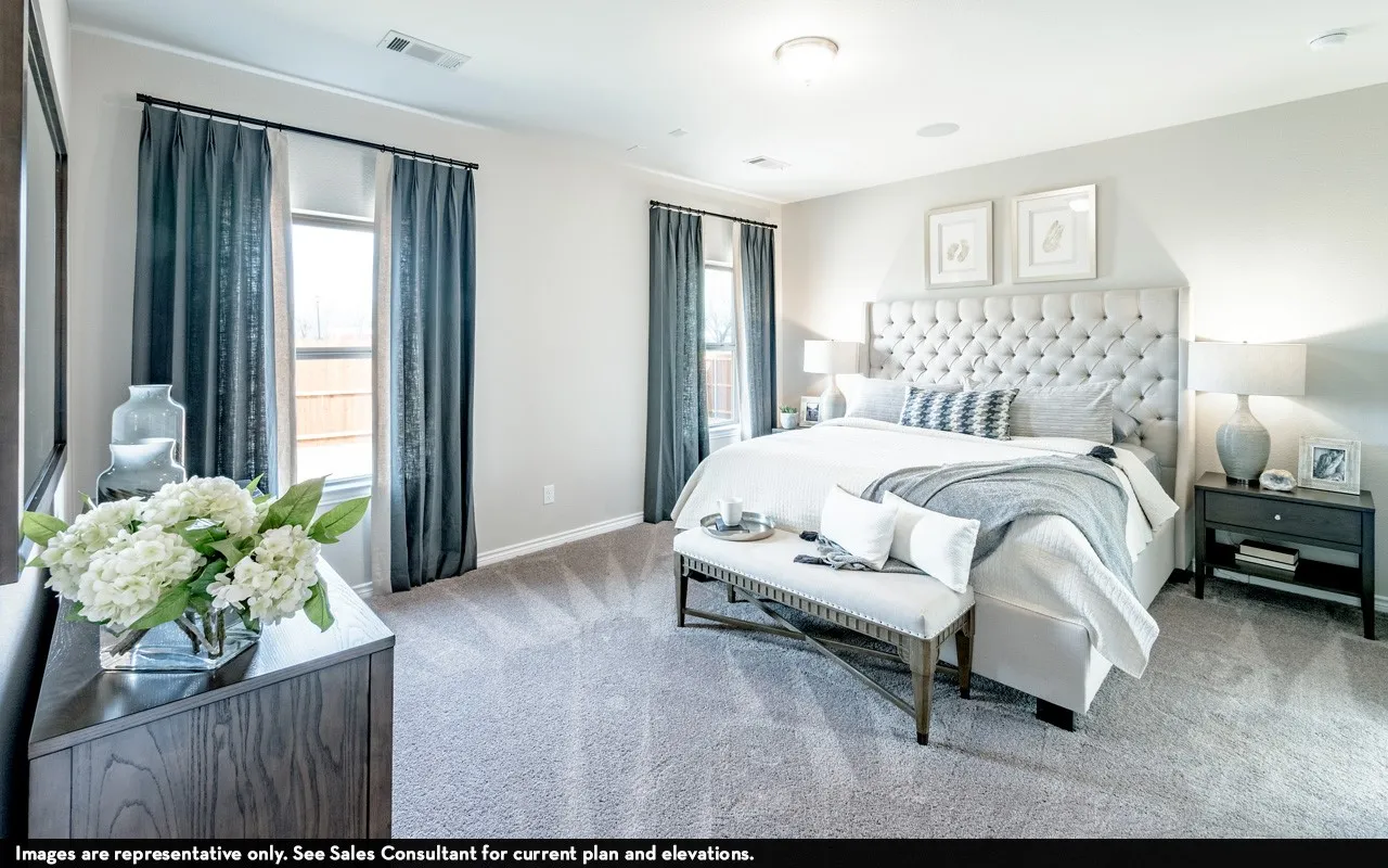 Recessed lighting, light-toned walls, and carpeted flooring