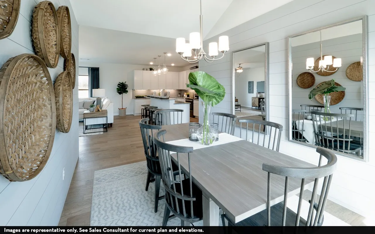 Vaulted ceiling with chandelier, light wood-finish flooring, white shiplap accent wall, recessed lighting, and kitchen island with pendant lights
