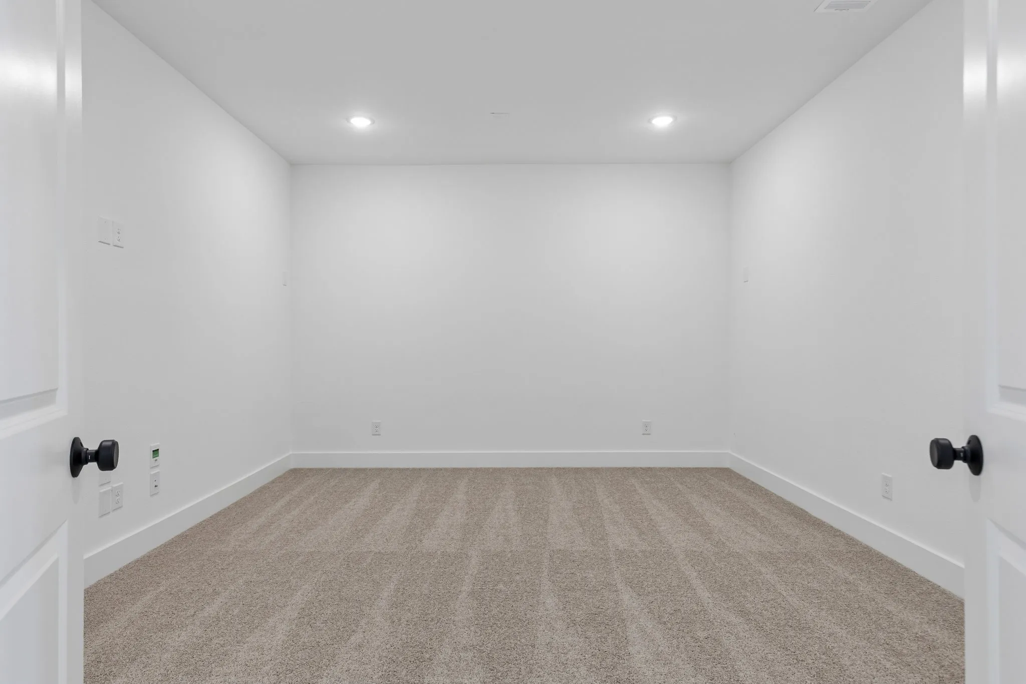 This spacious media room paired with adjacent game room create the ultimate family entertainment zone.