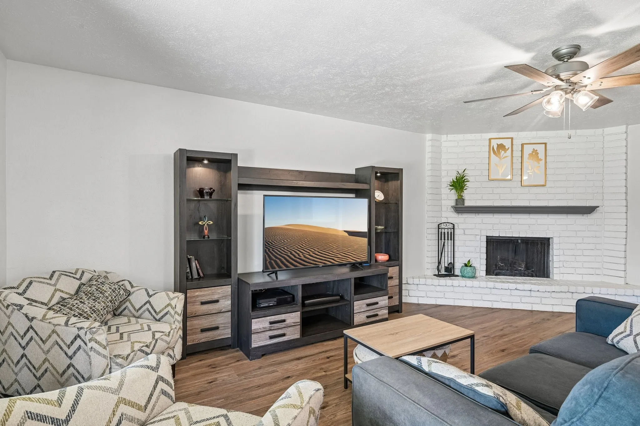 White-painted brick fireplace with a dark mantel