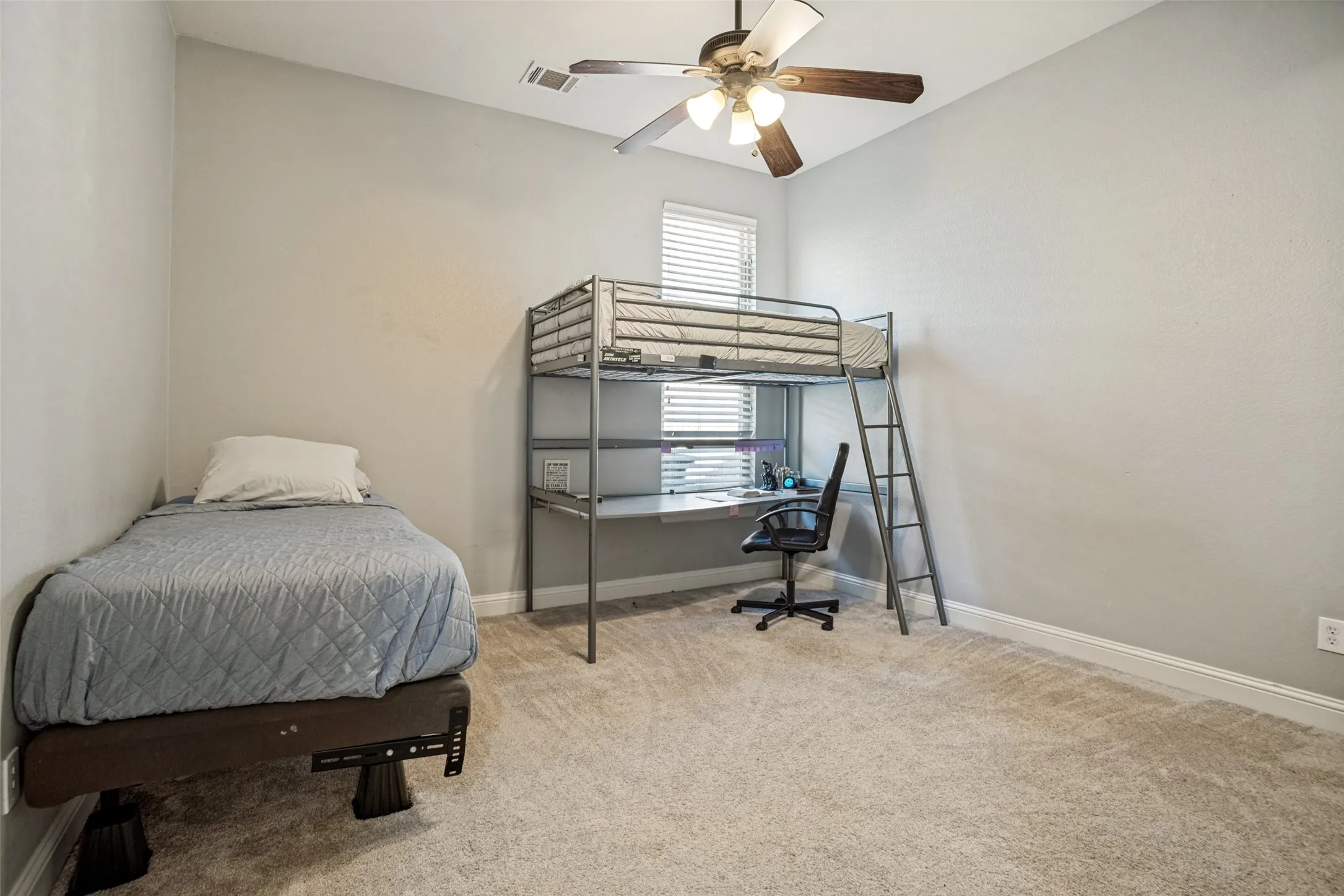 Vaulted ceiling, ceiling fan with light fixture, window with blinds, light gray wall paint, and carpeting