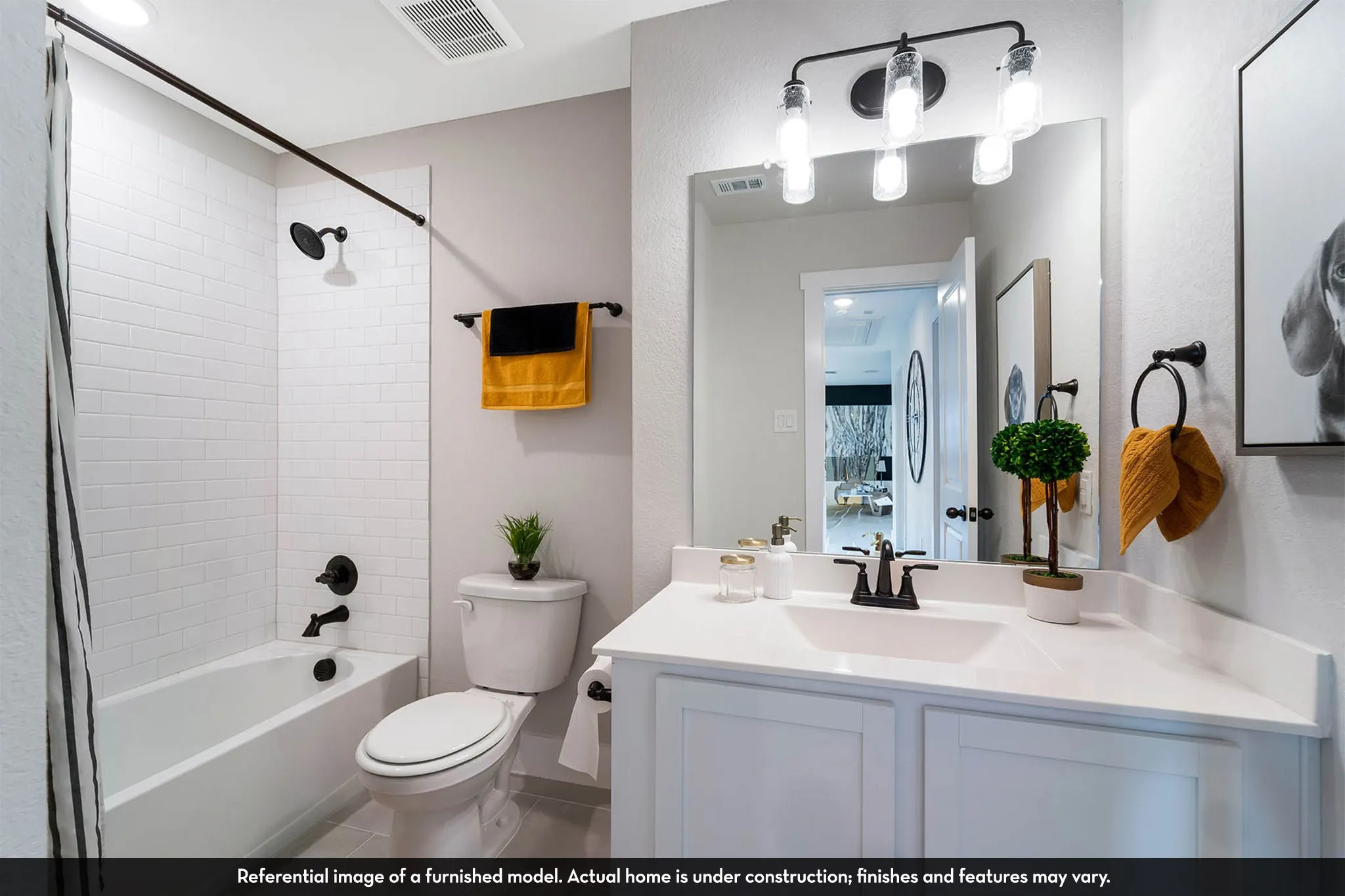 White subway tile shower surround with dark bronze fixtures