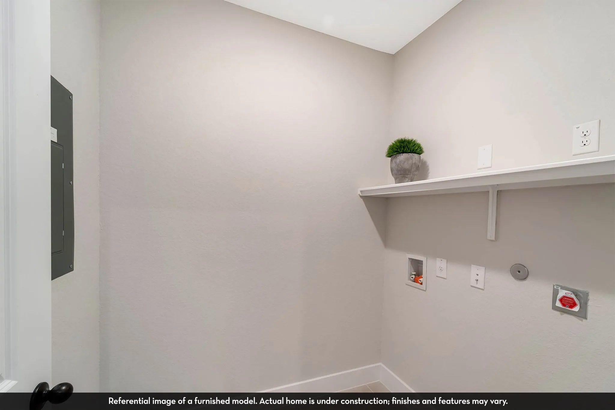 Built-in shelving and utility connections for laundry appliances