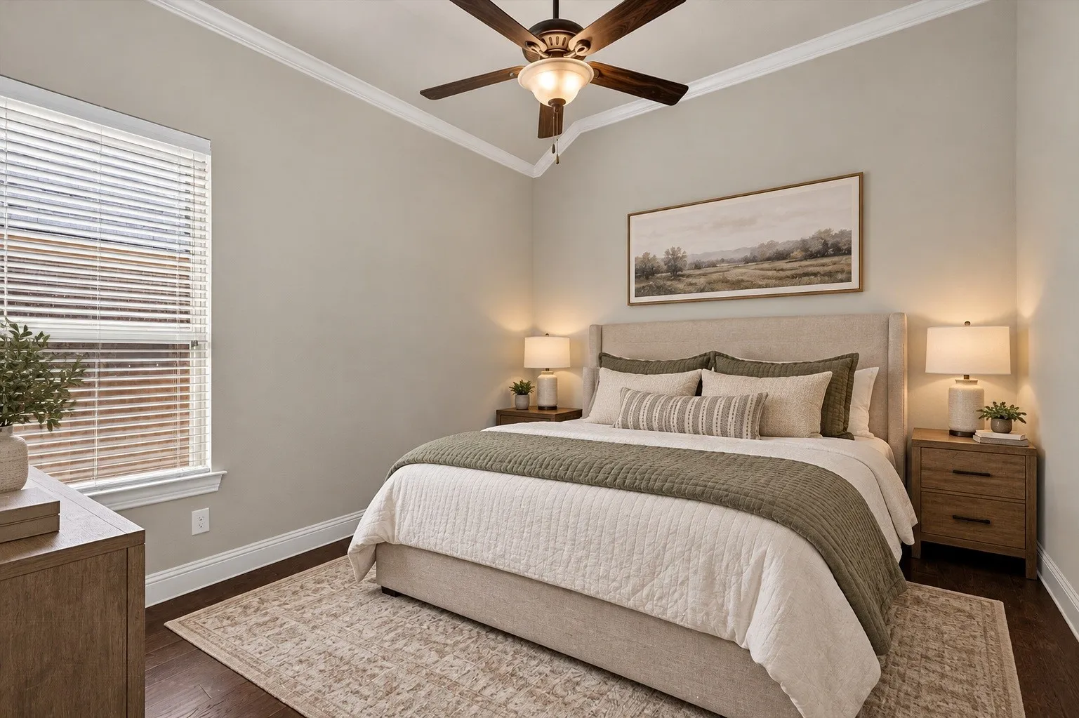 Vaulted ceiling with a ceiling fan, crown molding, and wood-finish flooring