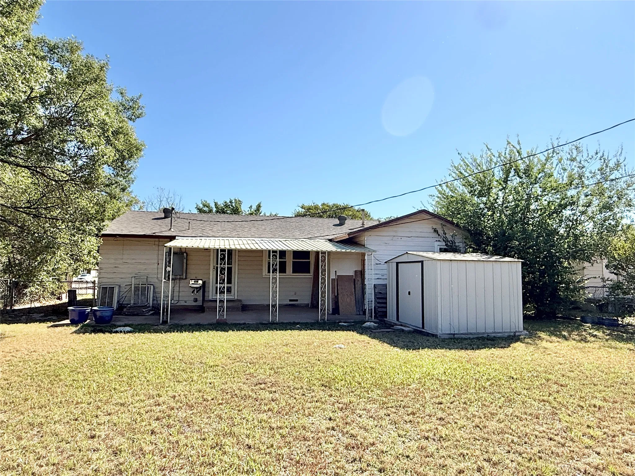 Large yard with storage building