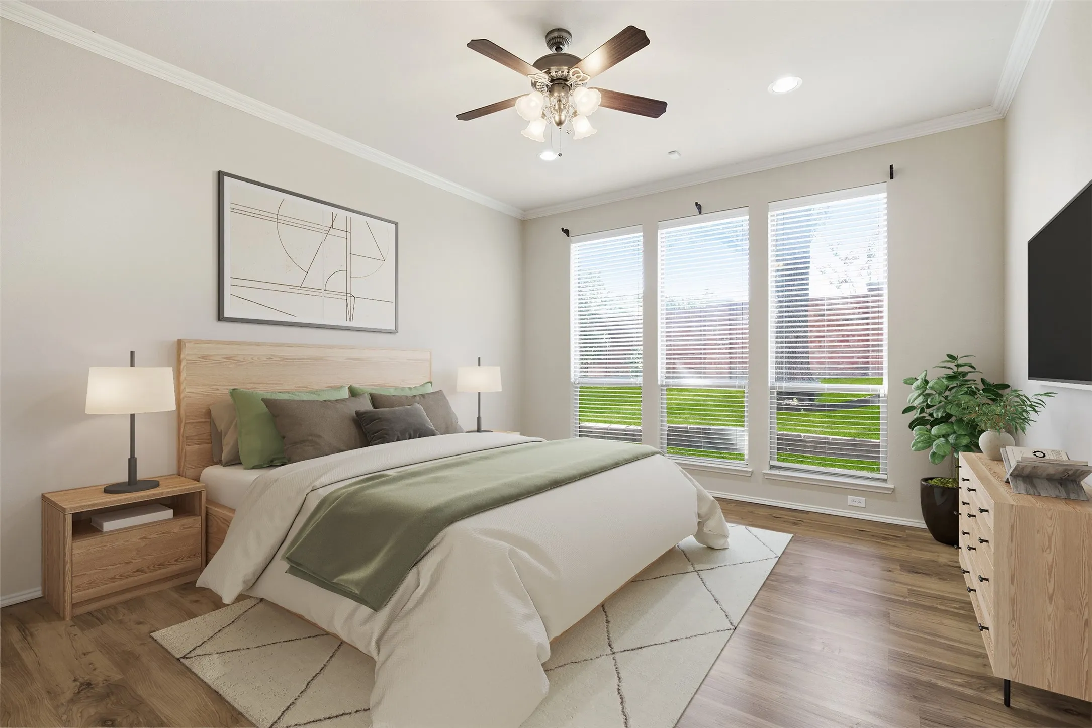 Crown molding, wood-finish flooring, recessed lighting, ceiling fan, and a trio of large windows. Virtually Staged
