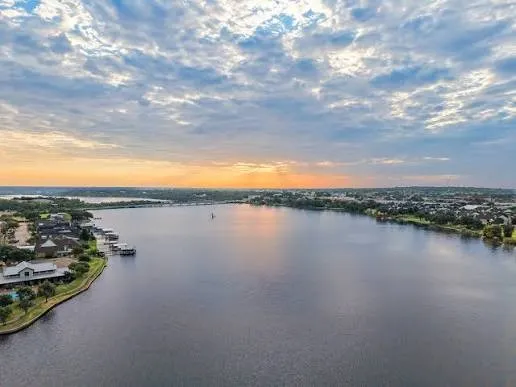 Expansive waterfront with a wide body of water and distant shoreline