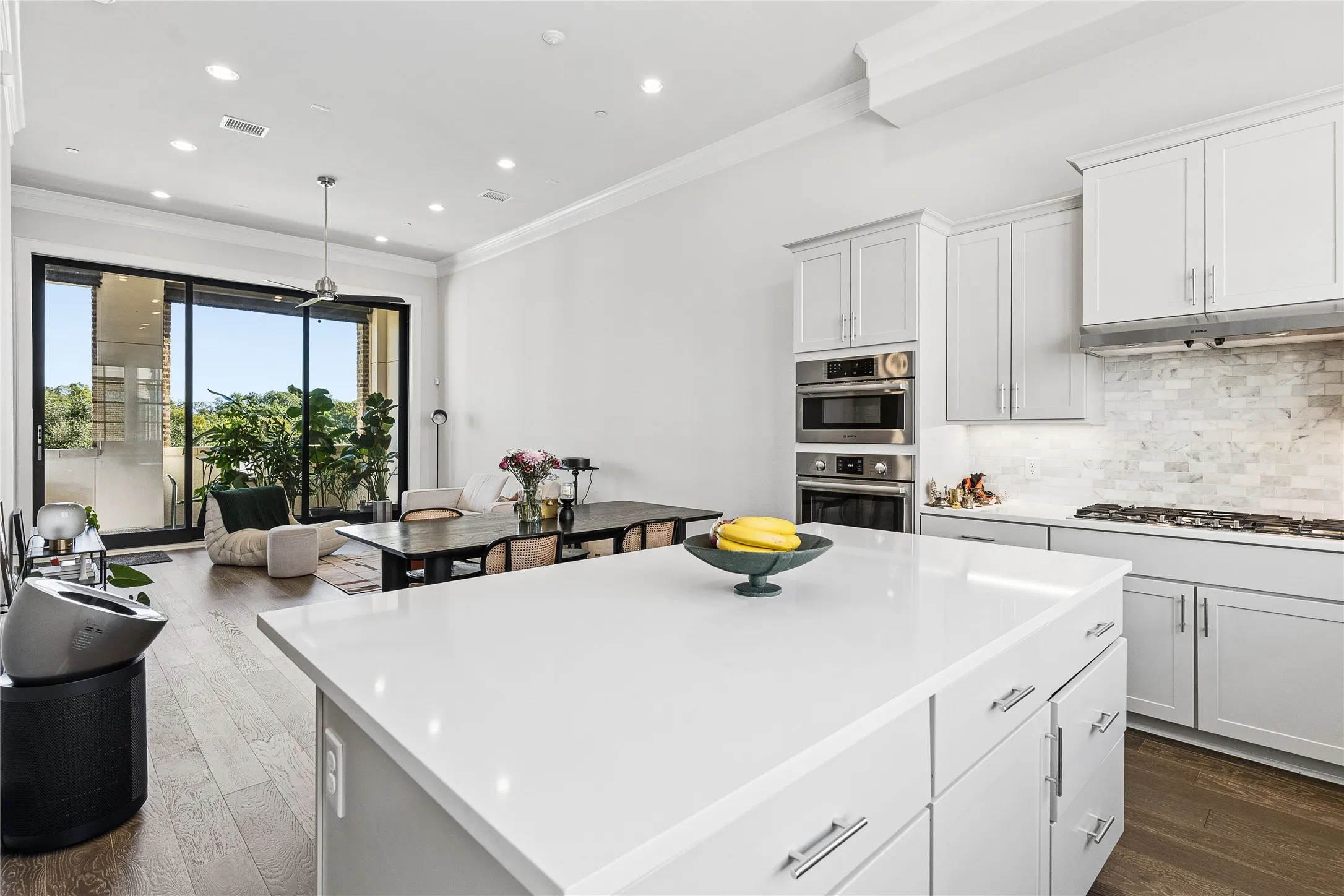 Kitchen opens to dining and living areas.