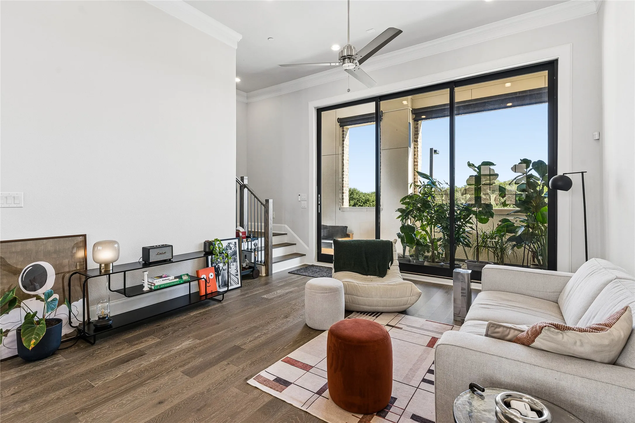 Ten-foot sliding glass panel doors open all the way to extend the living space to a private balcony.