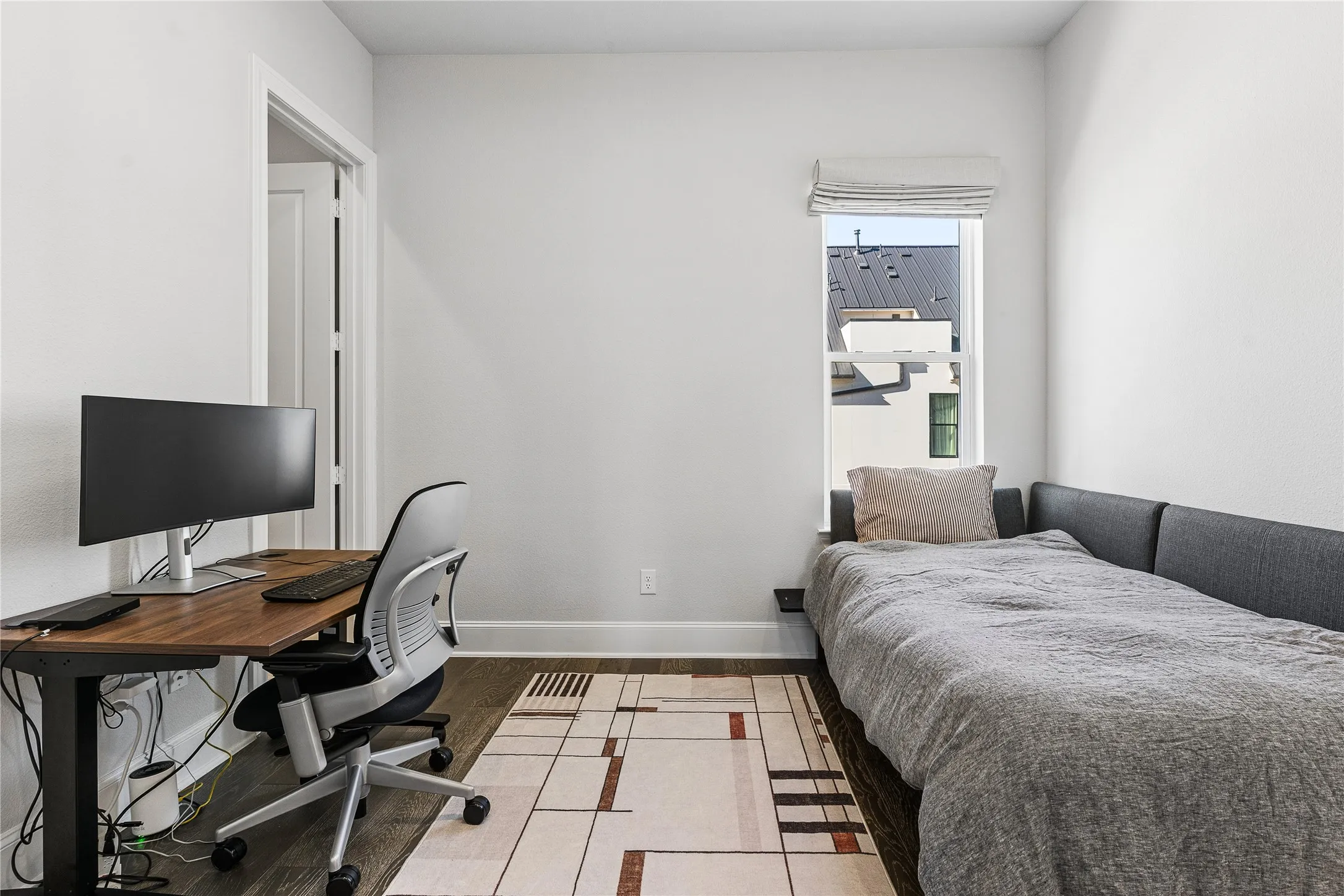 Third floor guest bedroom features en suite bathroom.