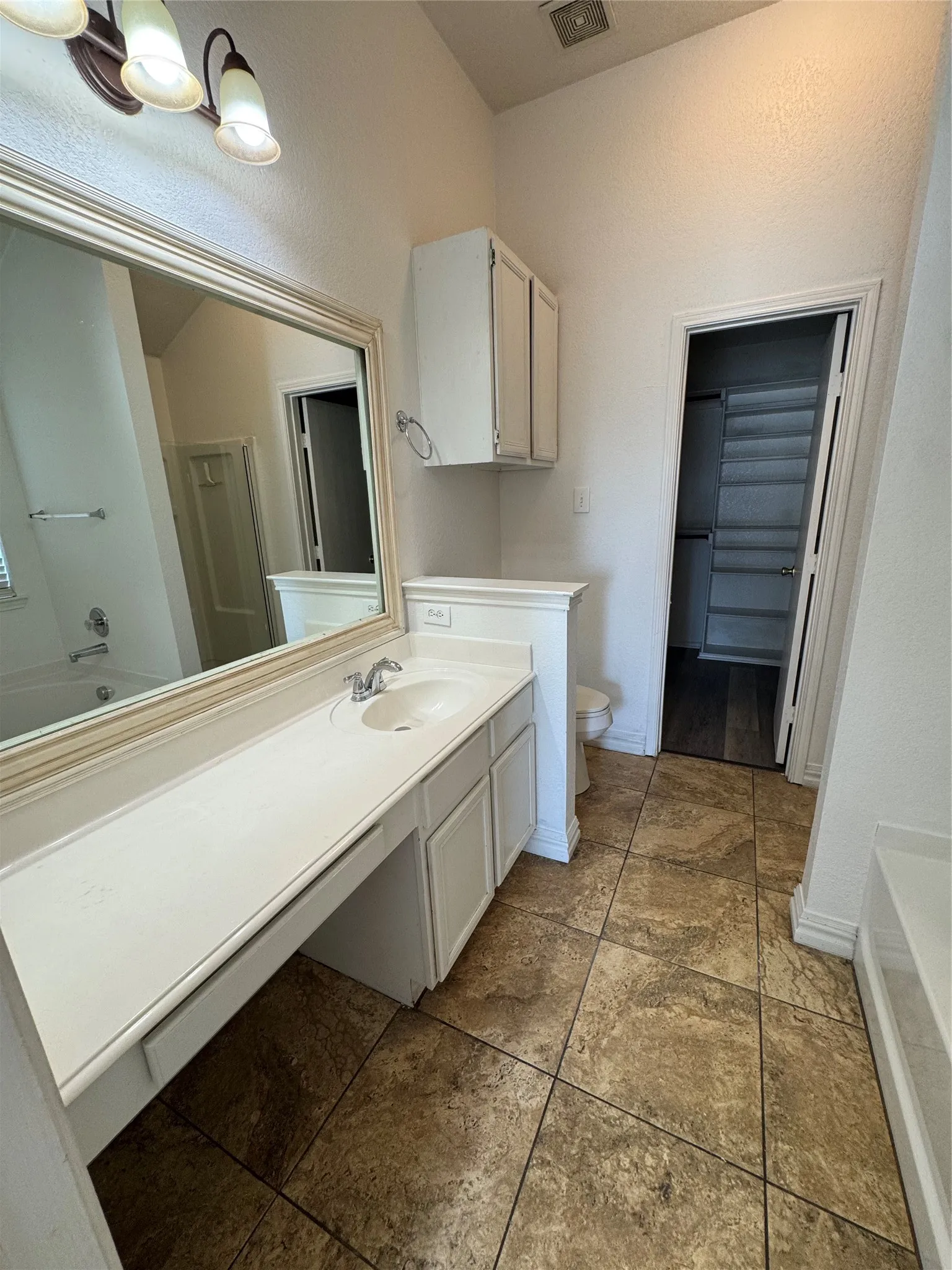 Spacious vanity with an integrated sink and ample counter space